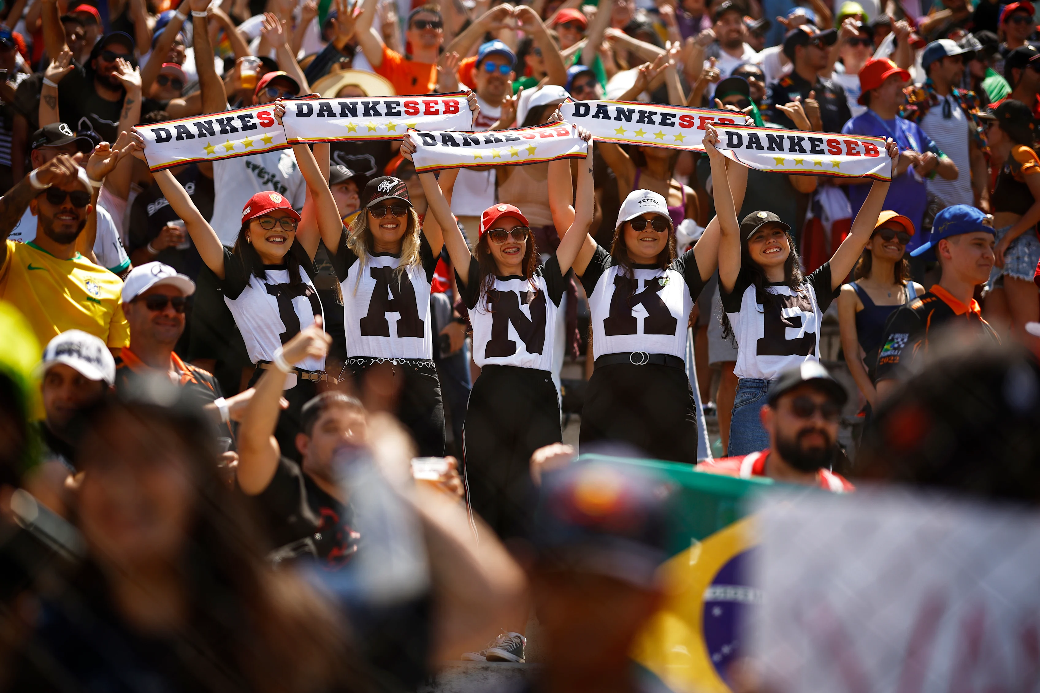 SAO PAULO, BRAZIL - NOVEMBER 13: Sebastian Vettel of Germany and Aston Martin F1 Team fans show