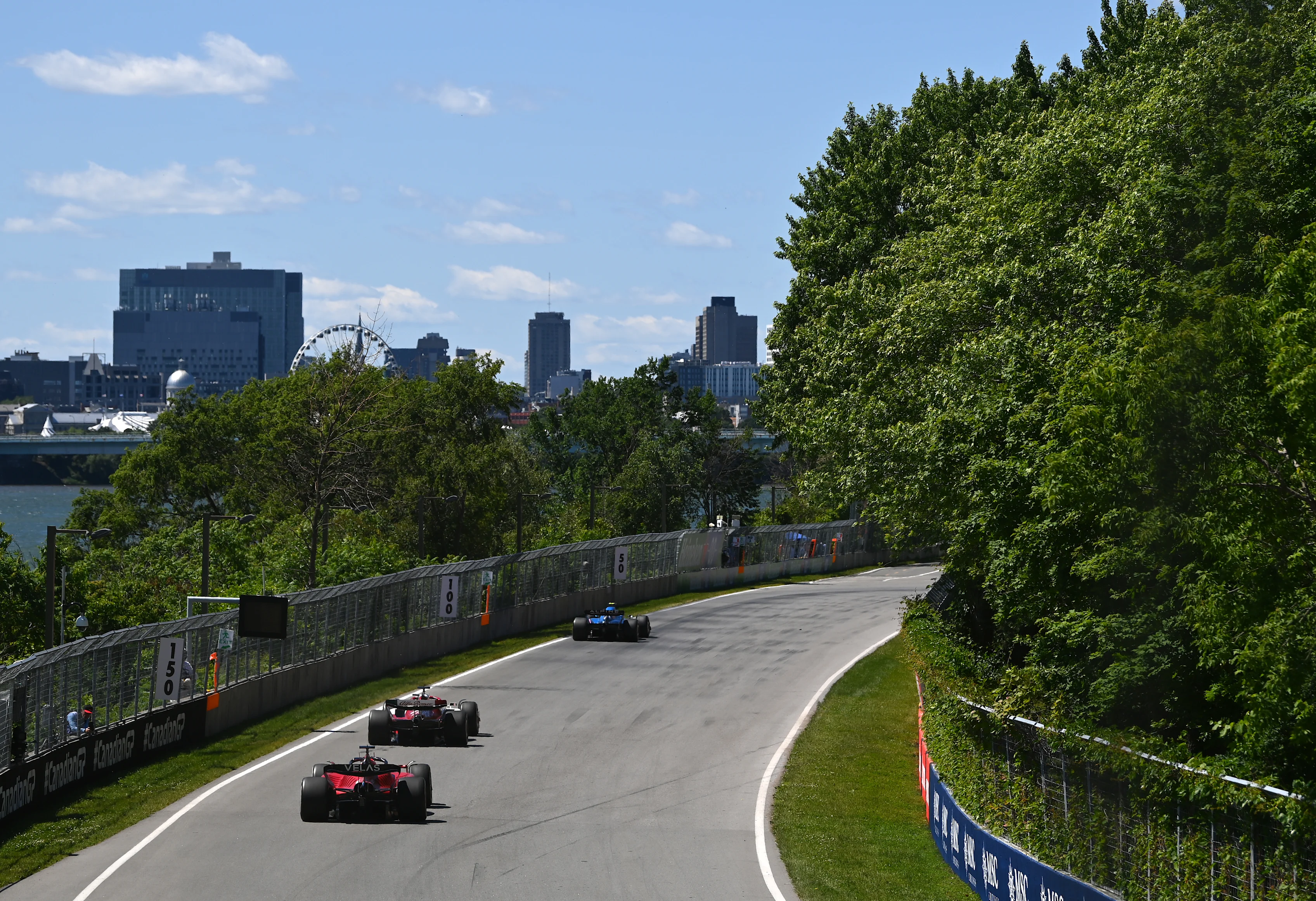 MONTREAL, QUEBEC - JUNE 19: Charles Leclerc of Monaco driving the (16) Ferrari F1-75 follows