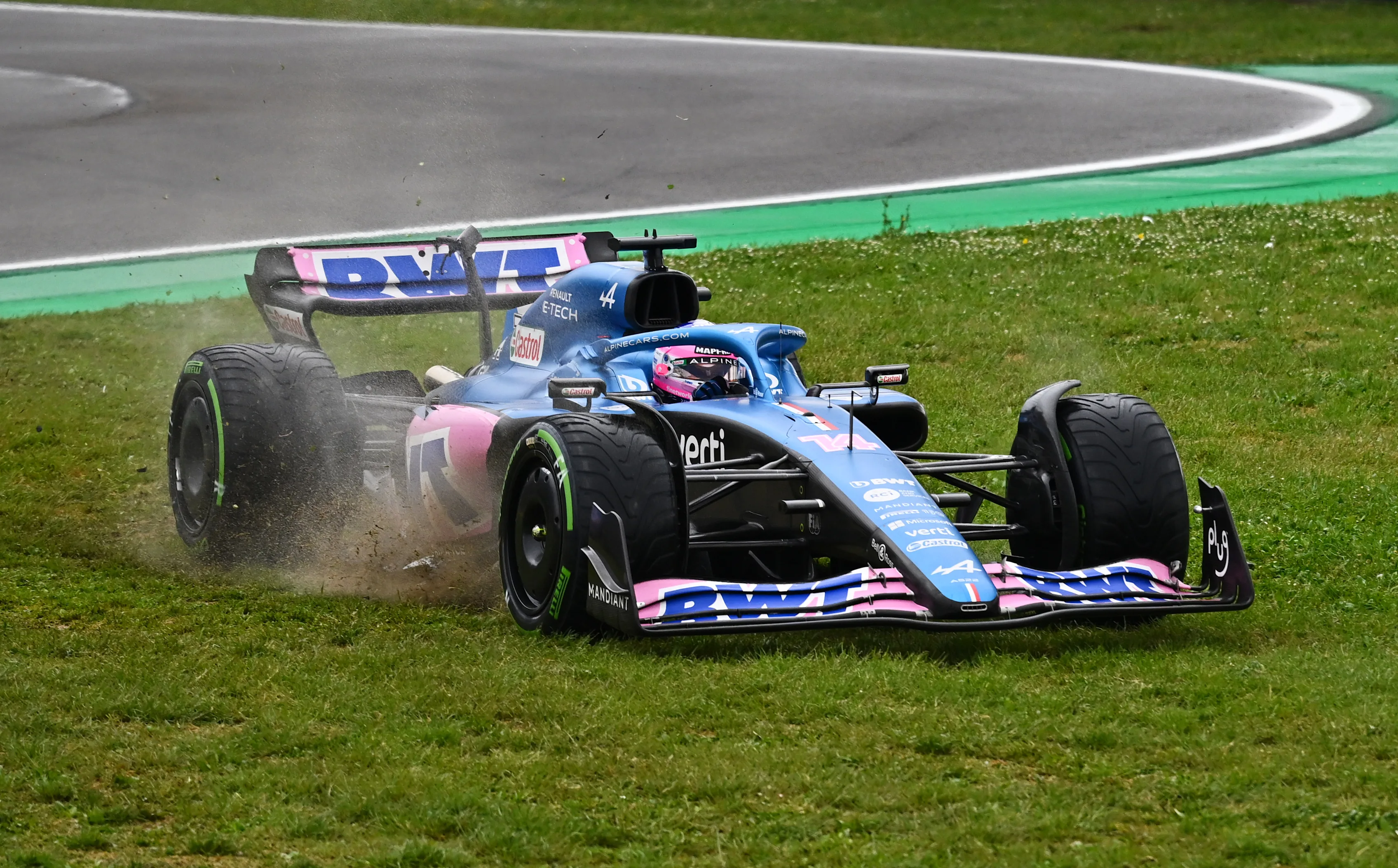 IMOLA, ITALY - APRIL 24: Fernando Alonso of Spain driving the (14) Alpine F1 A522 Renault runs wide during the F1 Grand Prix of Emilia Romagna at Autodromo Enzo e Dino Ferrari on April 24, 2022 in Imola, Italy. (Photo by Clive Mason/Getty Images)