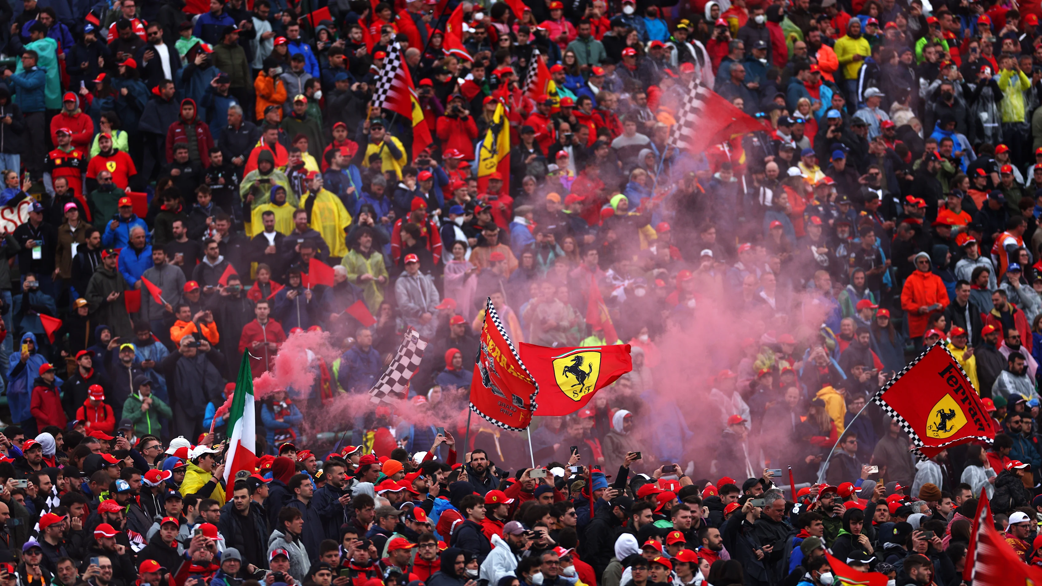 IMOLA, ITALY - APRIL 24: Fans show their support from the stands as they let off a flare during the