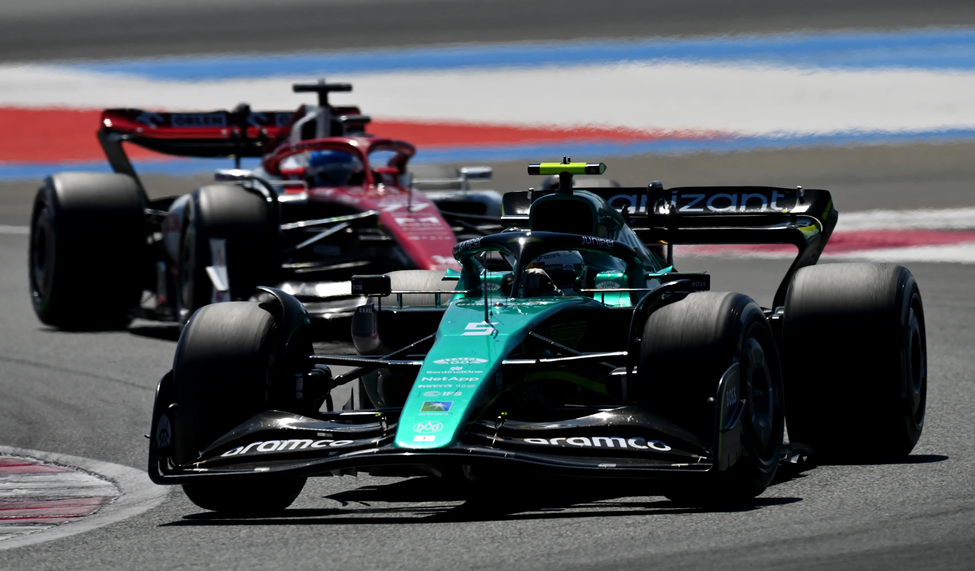 LE CASTELLET, FRANCE - JULY 24: Sebastian Vettel of Germany driving the (5) Aston Martin AMR22 Mercedes leads Valtteri Bottas of Finland driving the (77) Alfa Romeo F1 C42 Ferrari during the F1 Grand Prix of France at Circuit Paul Ricard on July 24, 2022 in Le Castellet, France. (Photo by Dan Mullan/Getty Images)