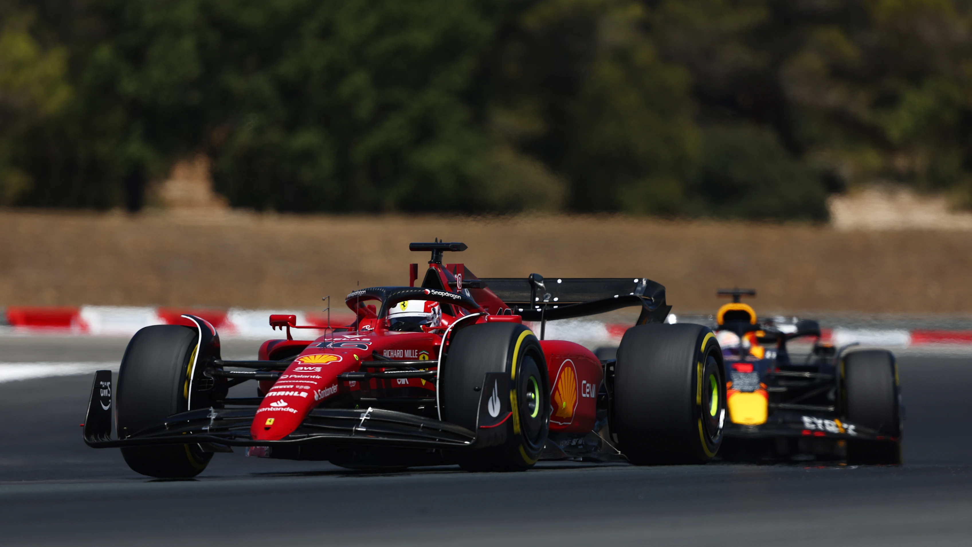 LE CASTELLET, FRANCE - JULY 24: Charles Leclerc of Monaco driving the (16) Ferrari F1-75 leads Max