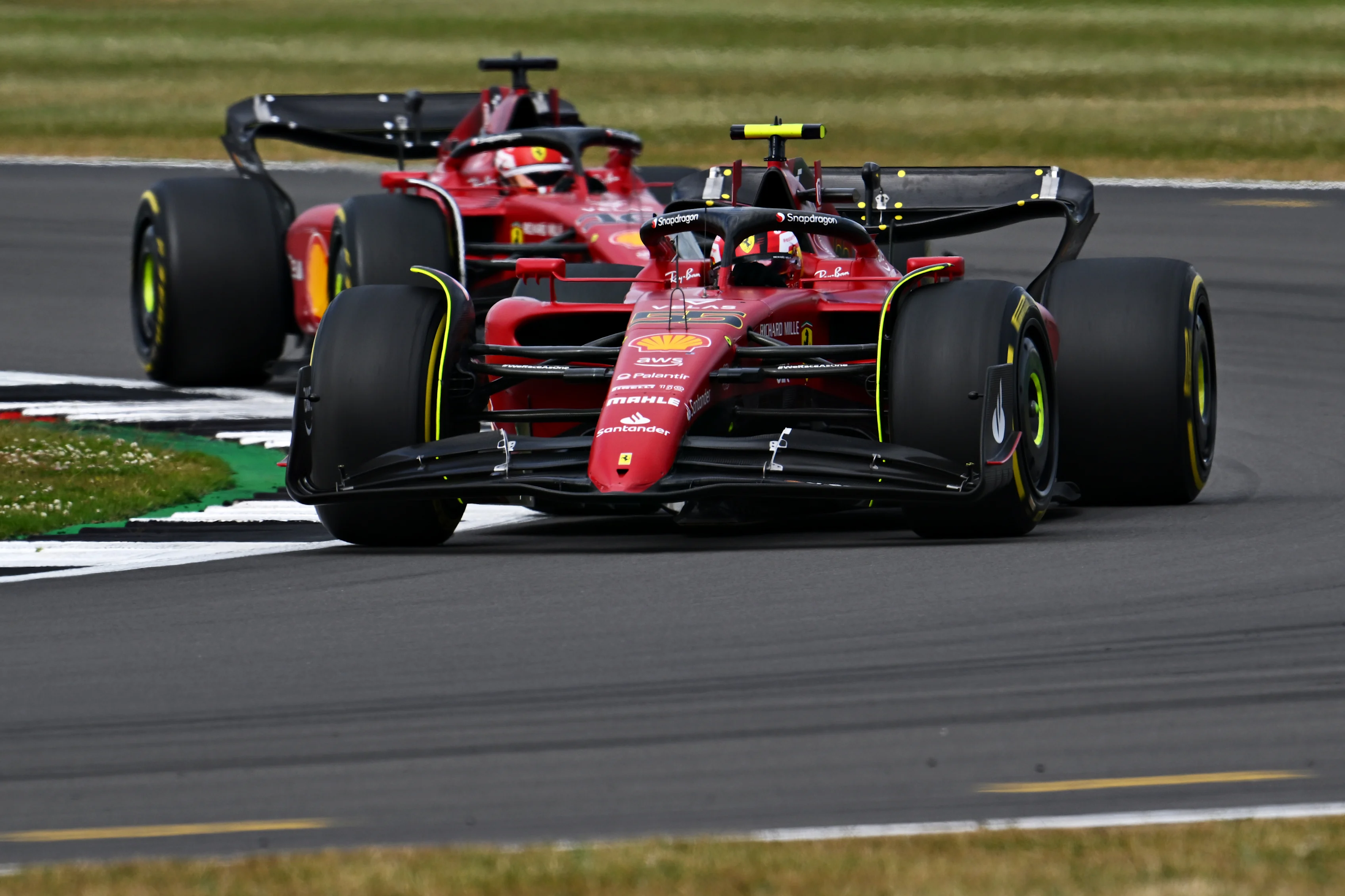 NORTHAMPTON, ENGLAND - JULY 03: Carlos Sainz of Spain driving (55) the Ferrari F1-75 leads Charles