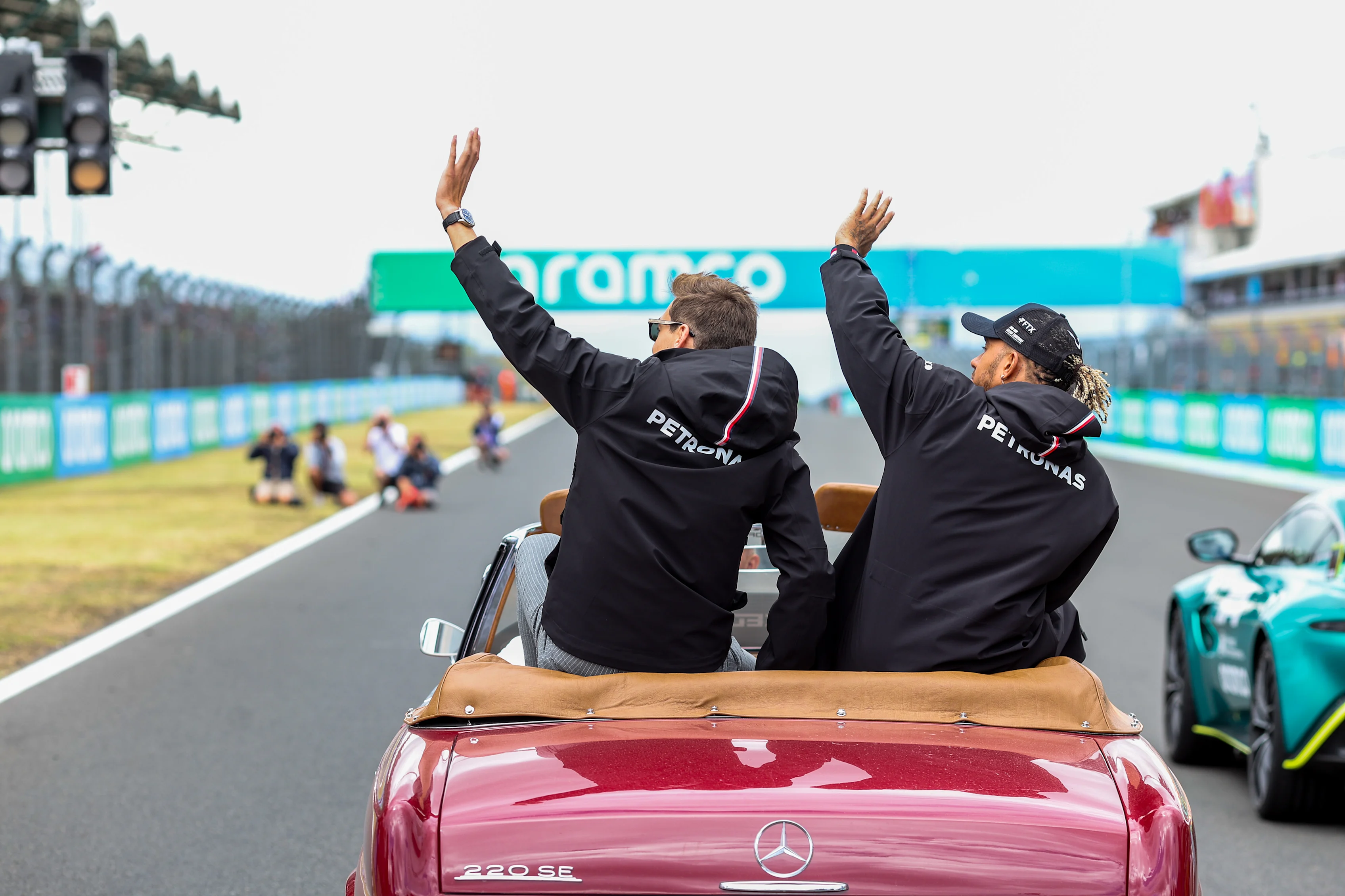 BUDAPEST, HUNGARY - JULY 31: George Russell and Lewis Hamilton of Mercedes and Great Britain during the drivers parade lap at the F1 Grand Prix of Hungary at Hungaroring on July 31, 2022 in Budapest, Hungary. (Photo by Peter Fox/Getty Images)