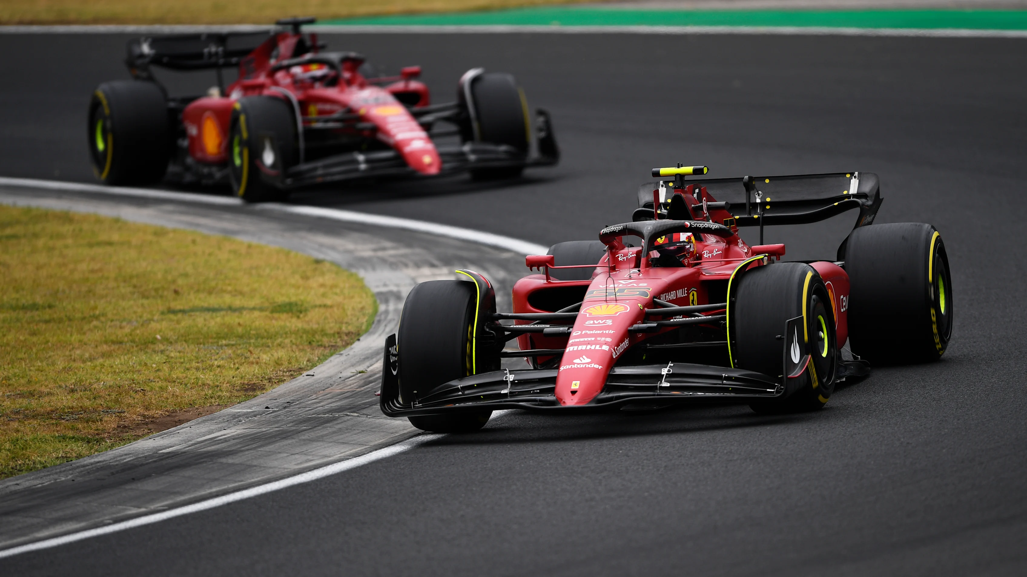 BUDAPEST, HUNGARY - JULY 31: Carlos Sainz of Spain driving (55) the Ferrari F1-75 leads Charles