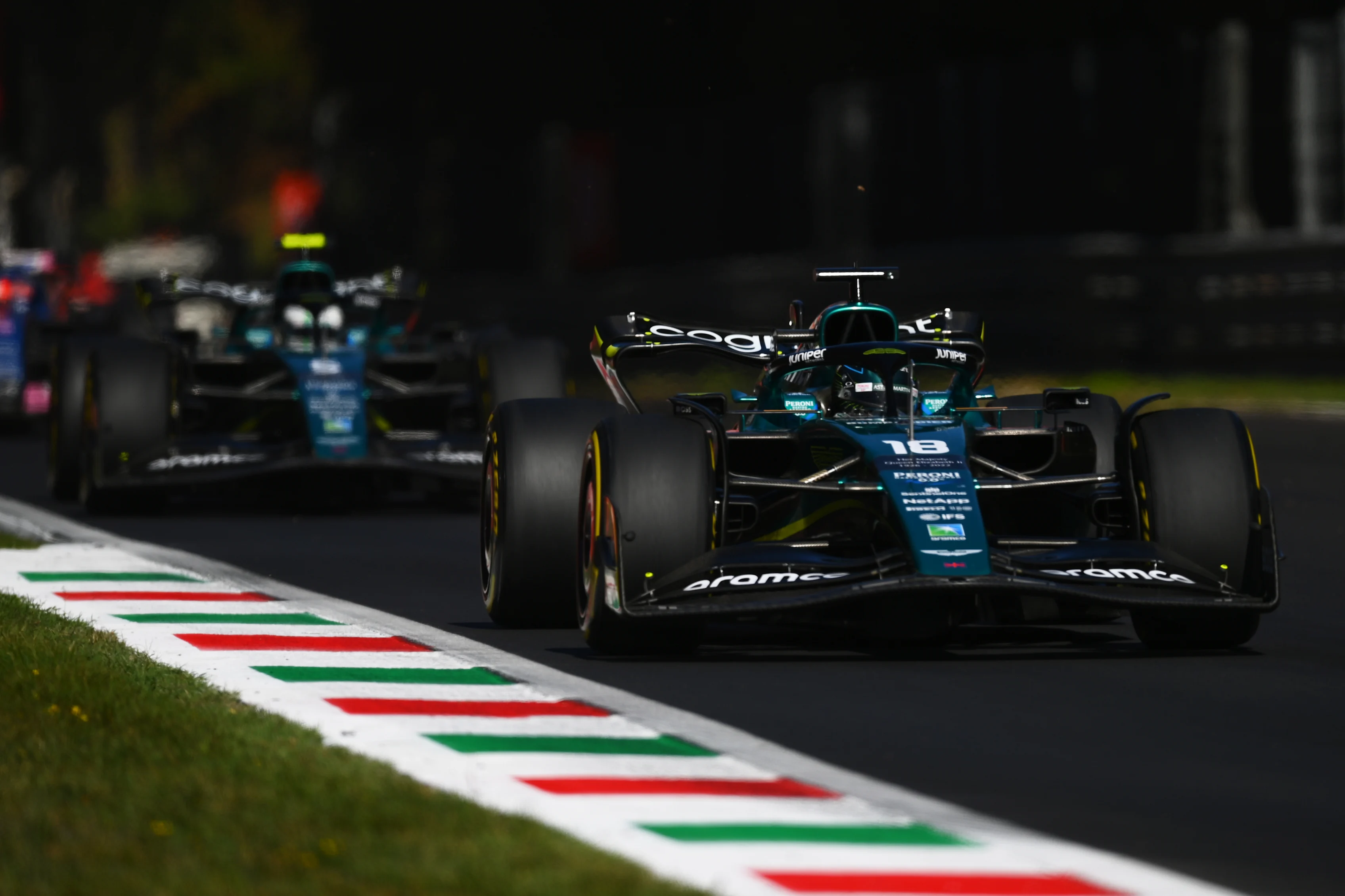 MONZA, ITALY - SEPTEMBER 11: Lance Stroll of Canada driving the (18) Aston Martin AMR22 Mercedes leads Sebastian Vettel of Germany driving the (5) Aston Martin AMR22 Mercedes during the F1 Grand Prix of Italy at Autodromo Nazionale Monza on September 11, 2022 in Monza, Italy. (Photo by Dan Mullan/Getty Images)