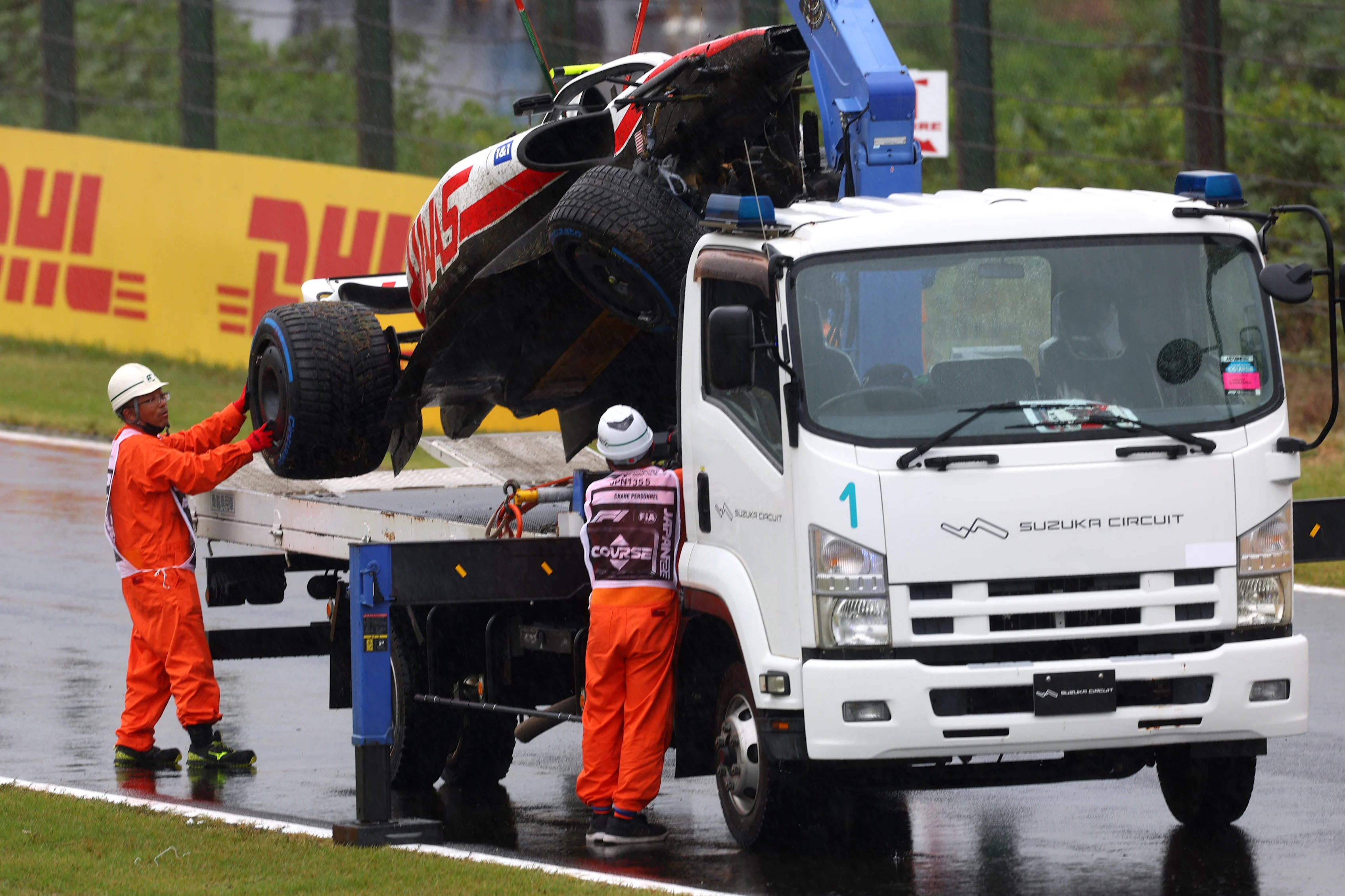 SUZUKA, JAPAN - OCTOBER 07: The car of Mick Schumacher of Germany and Haas F1 is collected from the track after a crash during practice ahead of the F1 Grand Prix of Japan at Suzuka International Racing Course on October 07, 2022 in Suzuka, Japan. (Photo by Dan Istitene - Formula 1/Formula 1 via Getty Images)