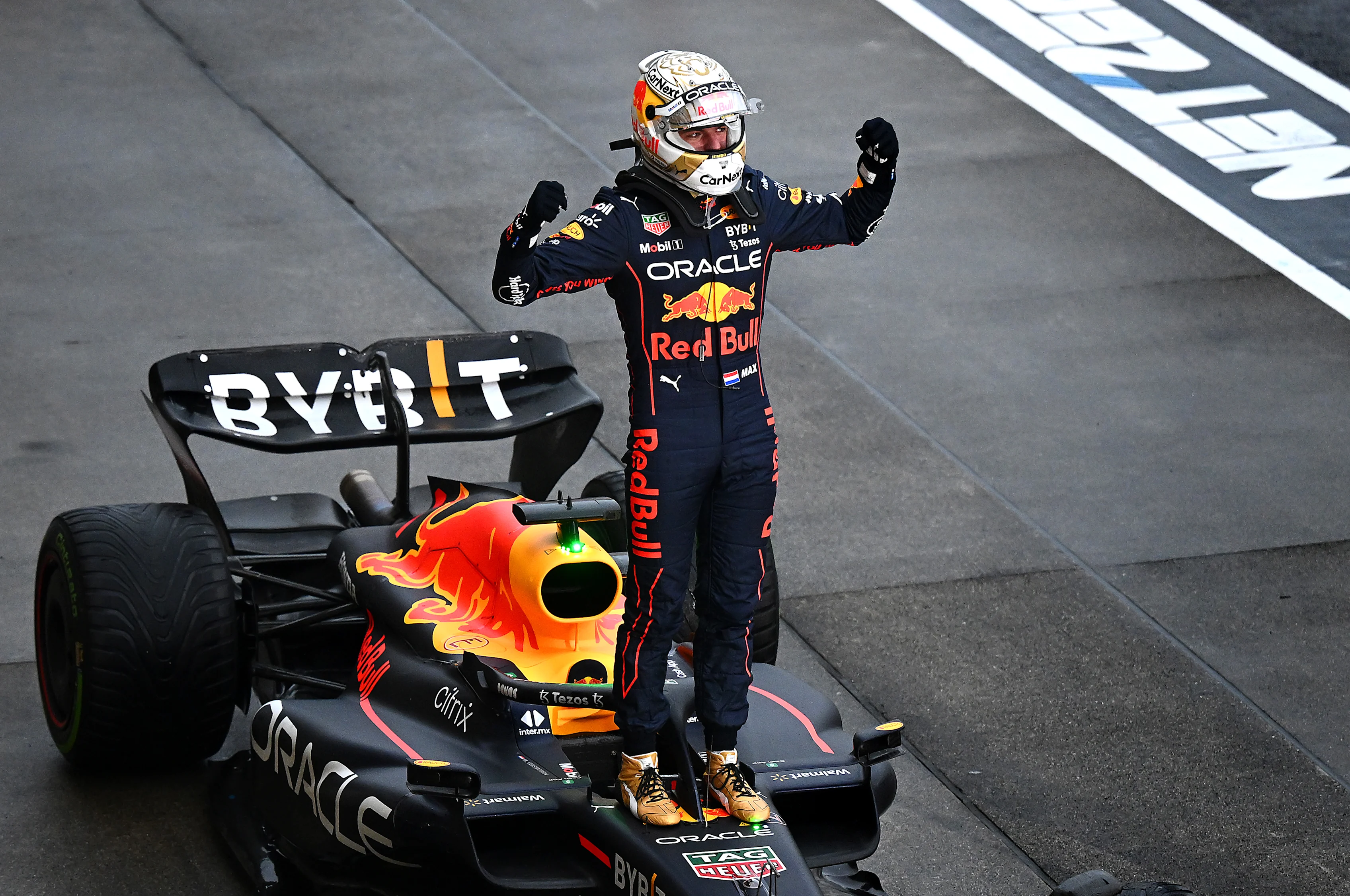 SUZUKA, JAPAN - OCTOBER 09: Race winner and 2022 F1 World Drivers Champion Max Verstappen of Netherlands and Oracle Red Bull Racing celebrates in parc ferme during the F1 Grand Prix of Japan at Suzuka International Racing Course on October 09, 2022 in Suzuka, Japan. (Photo by Clive Mason/Getty Images)