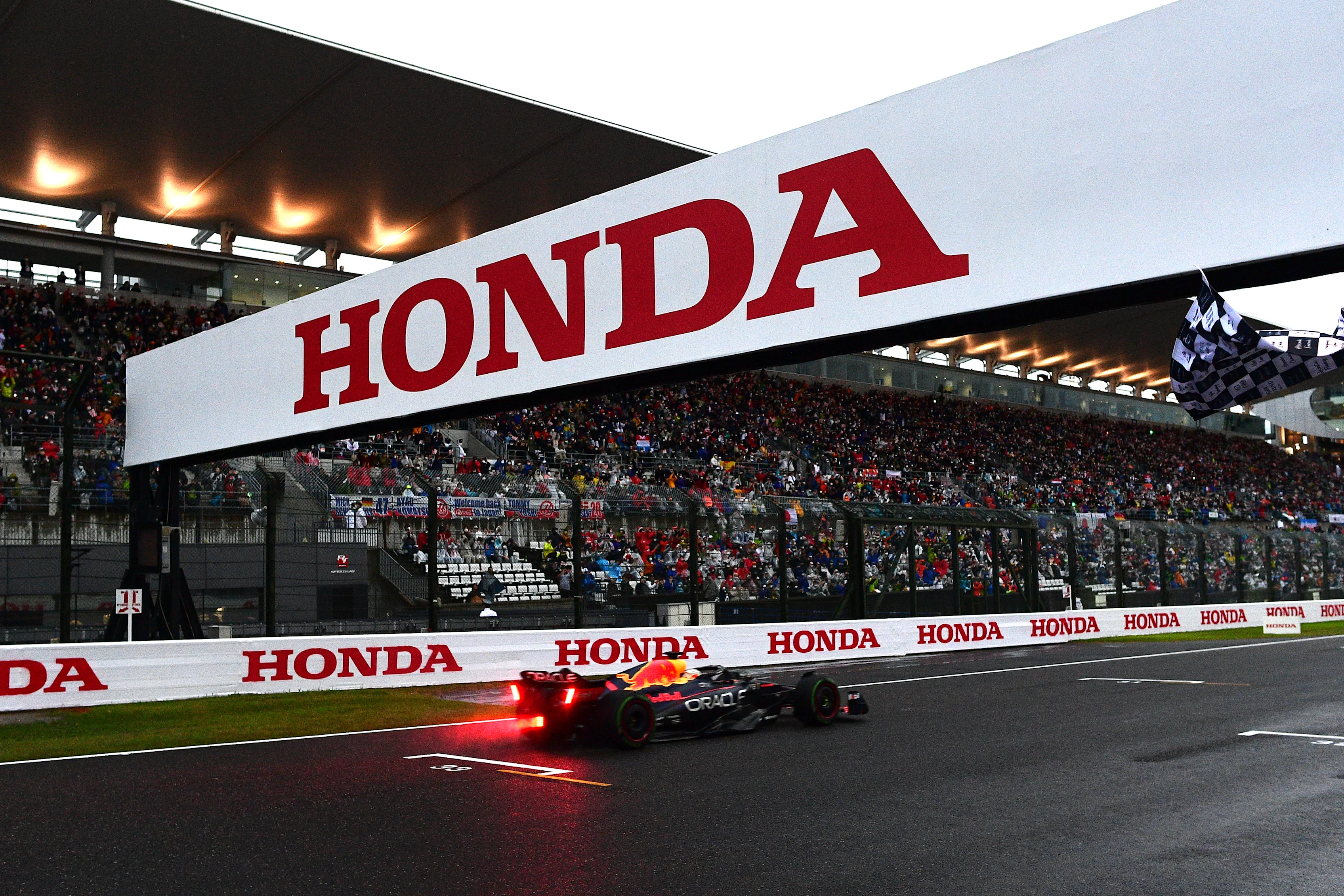 SUZUKA, JAPAN - OCTOBER 09: Race winner and 2022 F1 World Drivers Champion Max Verstappen of the