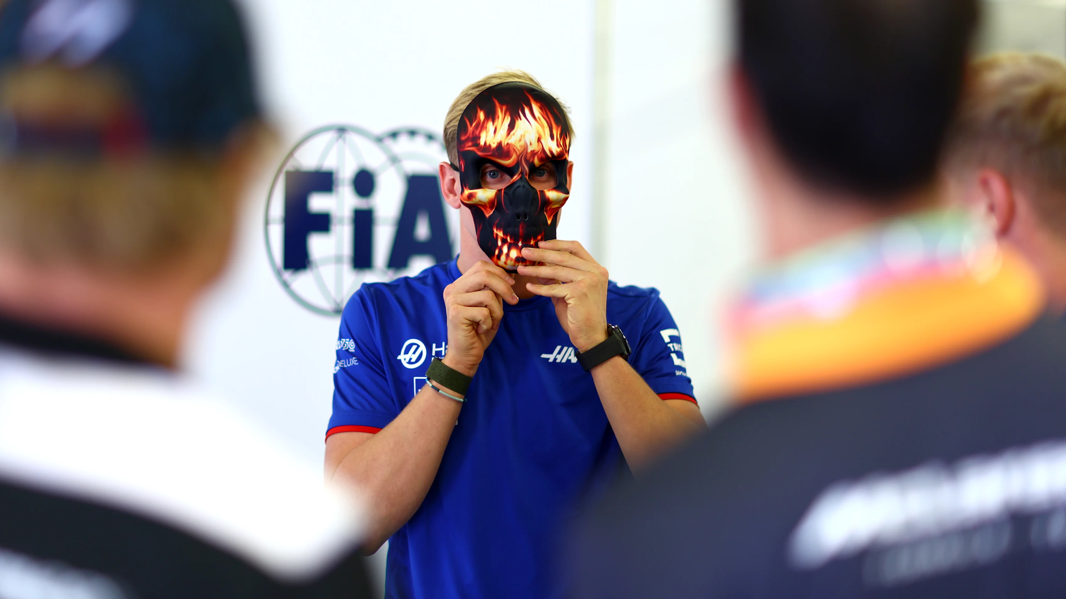 MEXICO CITY, MEXICO - OCTOBER 30: Mick Schumacher of Germany and Haas F1 puts on a mask prior to the F1 Grand Prix of Mexico at Autodromo Hermanos Rodriguez on October 30, 2022 in Mexico City, Mexico. (Photo by Dan Istitene - Formula 1/Formula 1 via Getty Images)