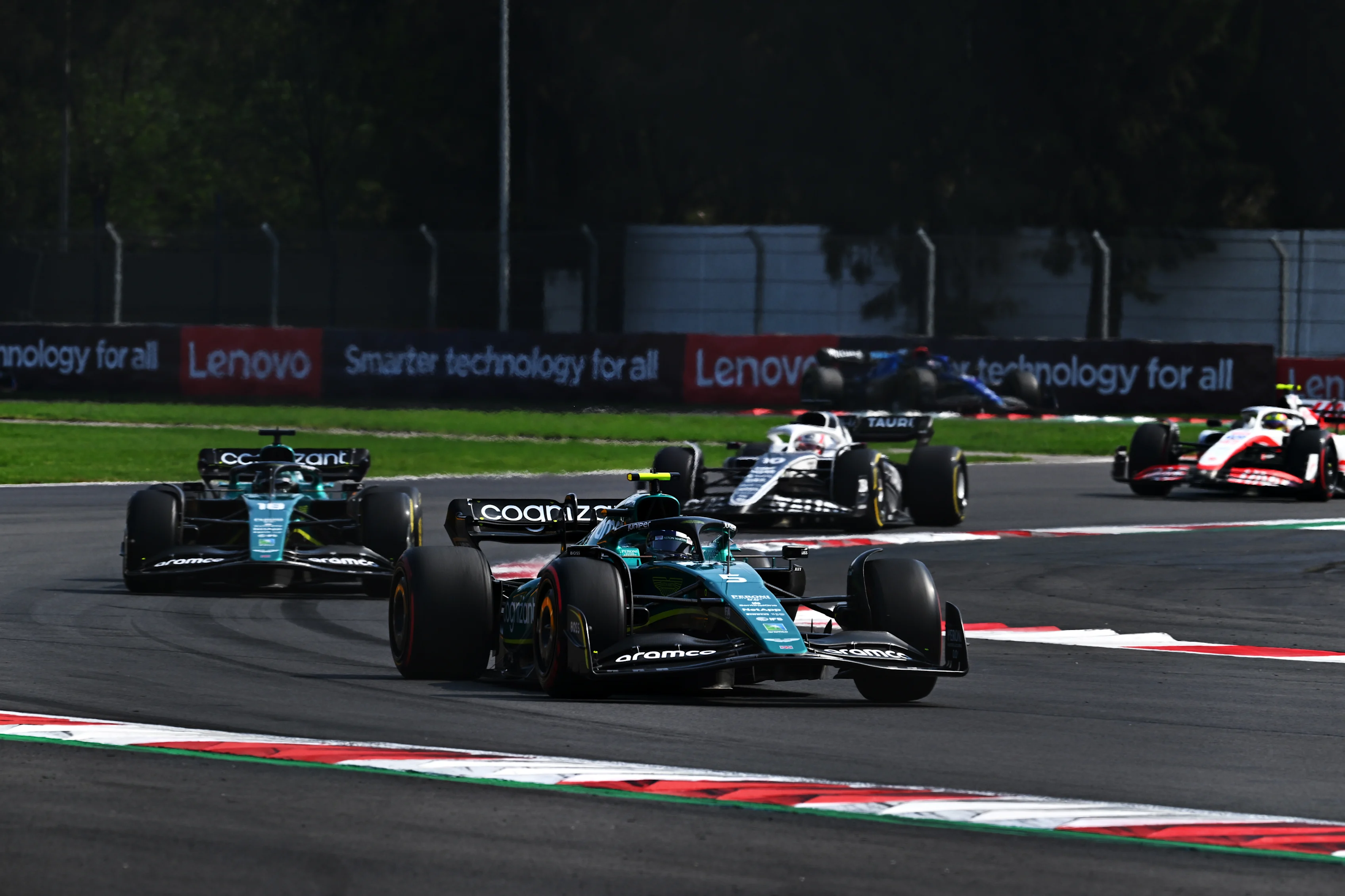 MEXICO CITY, MEXICO - OCTOBER 30: Sebastian Vettel of Germany driving the (5) Aston Martin AMR22 Mercedes leads Lance Stroll of Canada driving the (18) Aston Martin AMR22 Mercedes on track during the F1 Grand Prix of Mexico at Autodromo Hermanos Rodriguez on October 30, 2022 in Mexico City, Mexico. (Photo by Clive Mason - Formula 1/Formula 1 via Getty Images)