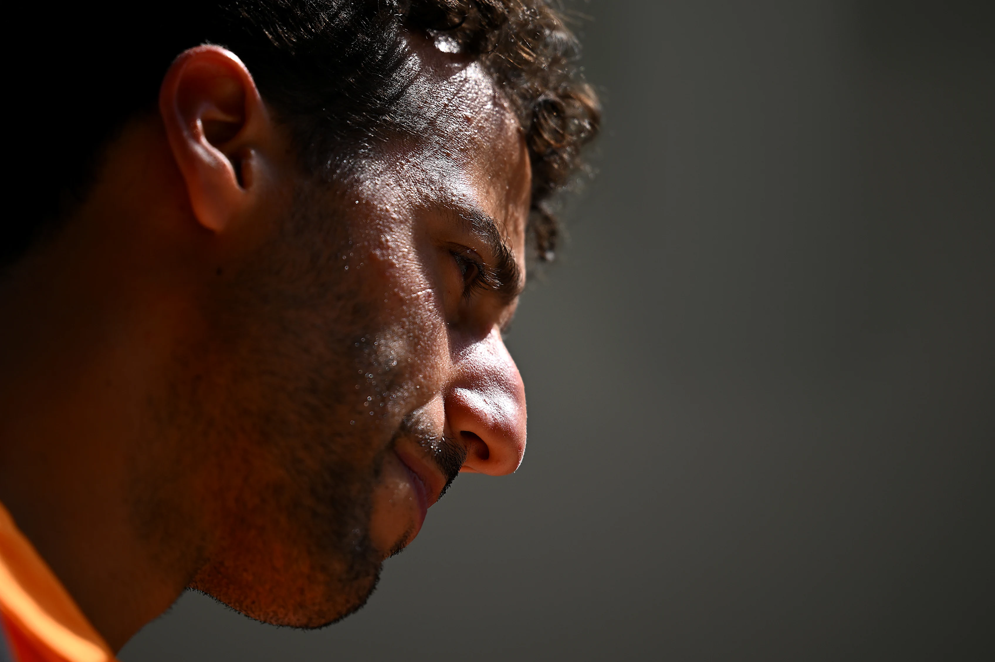MIAMI, FLORIDA - MAY 06: Daniel Ricciardo of Australia and McLaren looks on in the Paddock prior to