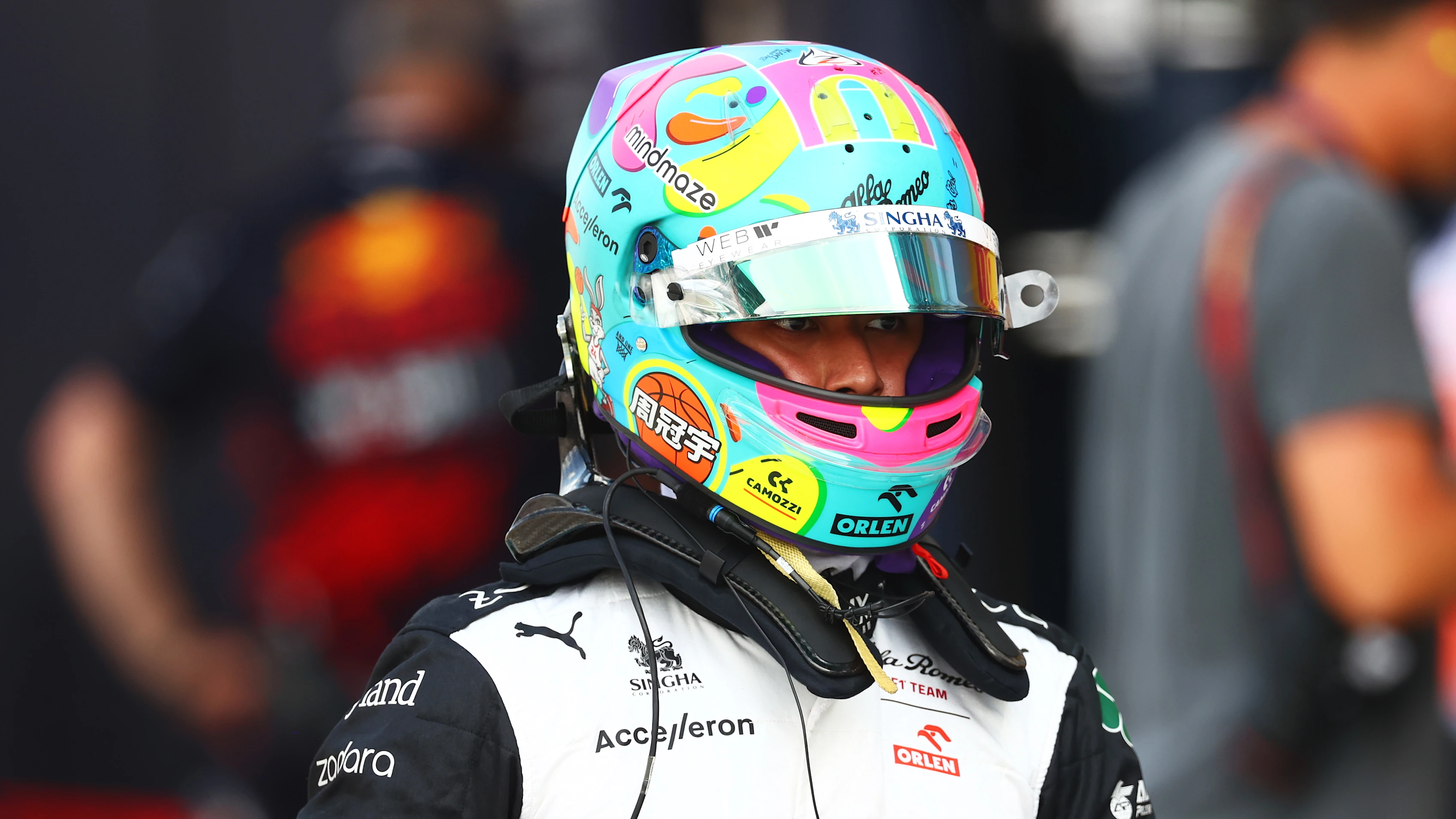 MIAMI, FLORIDA - MAY 07: 17th placed qualifier Zhou Guanyu of China and Alfa Romeo F1 walks in the