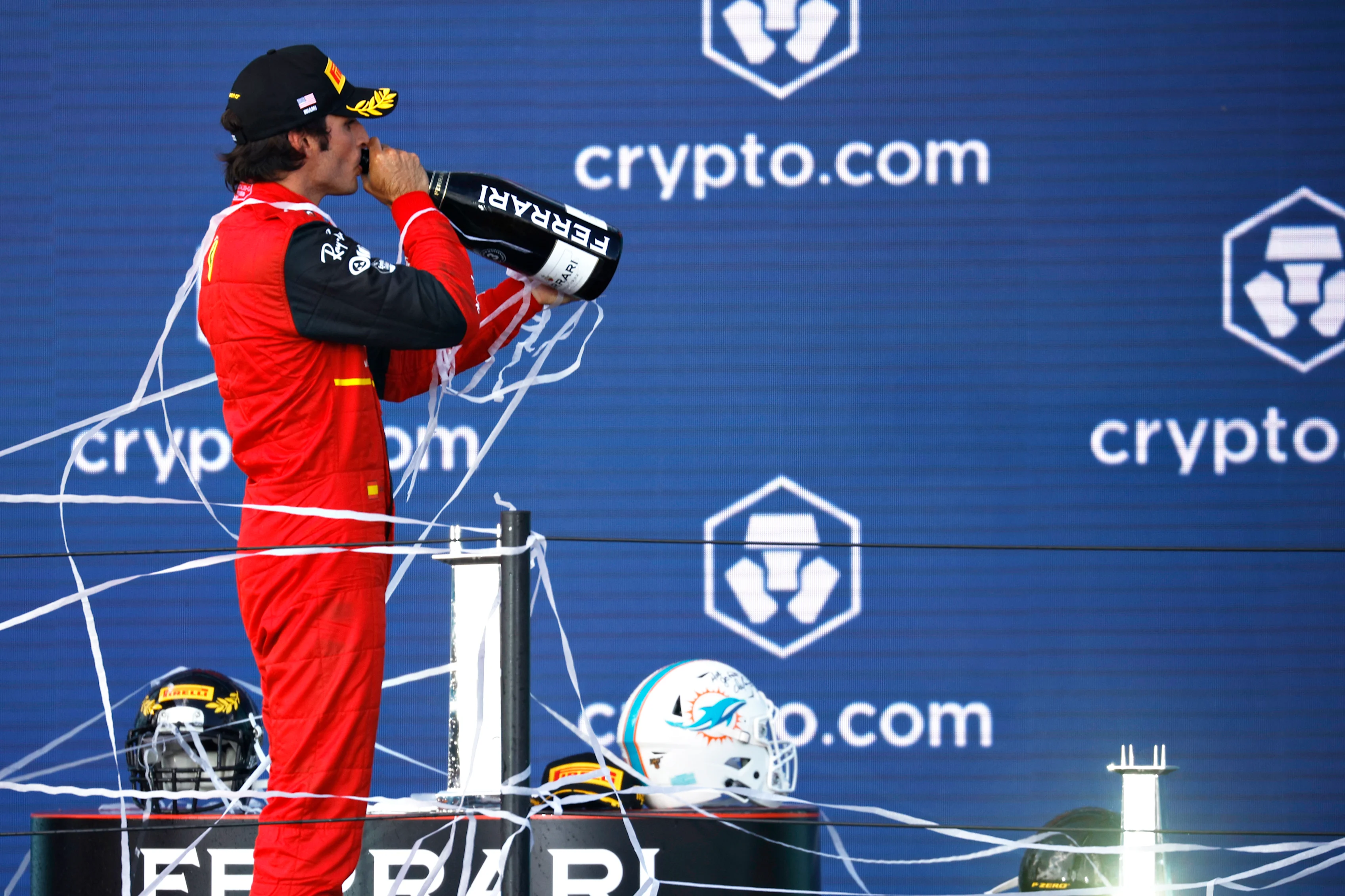 MIAMI, FLORIDA - MAY 08: Third placed Carlos Sainz of Spain and Ferrari celebrates on the podium during the F1 Grand Prix of Miami at the Miami International Autodrome on May 08, 2022 in Miami, Florida. (Photo by Chris Graythen/Getty Images)