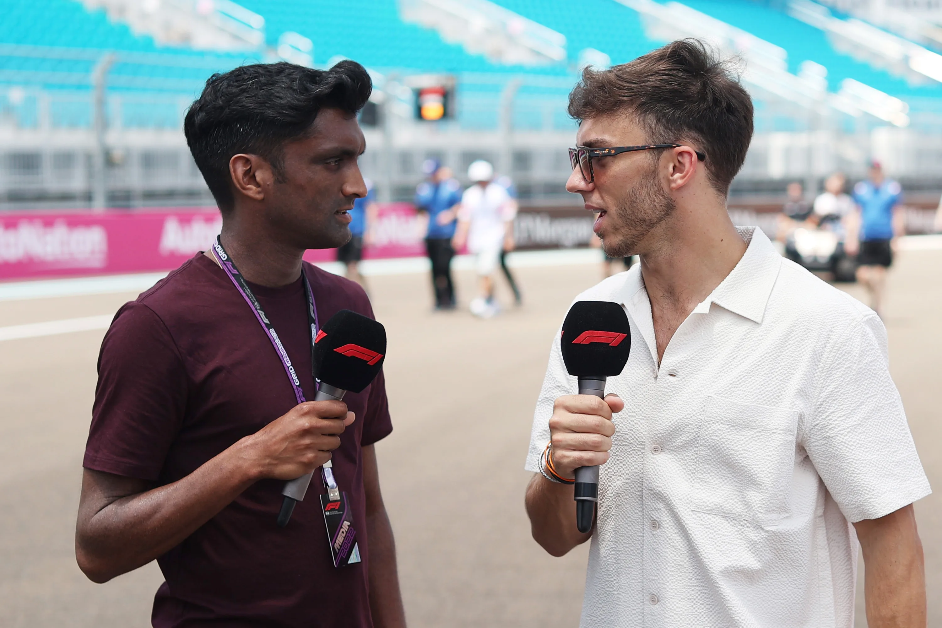 MIAMI, FLORIDA - MAY 05: Pierre Gasly of France and Scuderia AlphaTauri talks with F1 correspondent