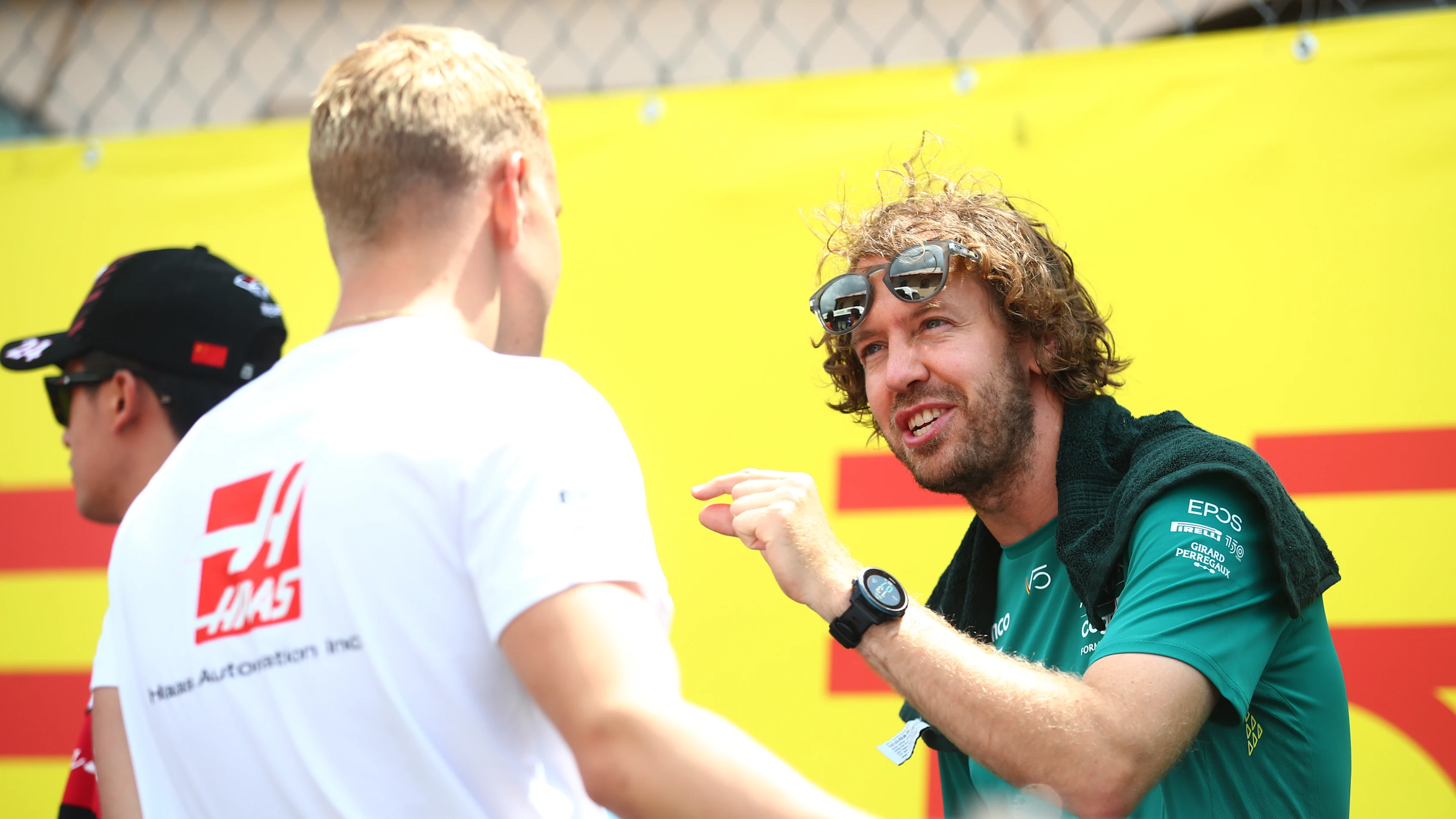 MONTE-CARLO, MONACO - MAY 29: Sebastian Vettel of Germany and Aston Martin F1 Team and Mick Schumacher of Germany and Haas F1 talk on the drivers parade ahead of the F1 Grand Prix of Monaco at Circuit de Monaco on May 29, 2022 in Monte-Carlo, Monaco. (Photo by Joe Portlock - Formula 1/Formula 1 via Getty Images)