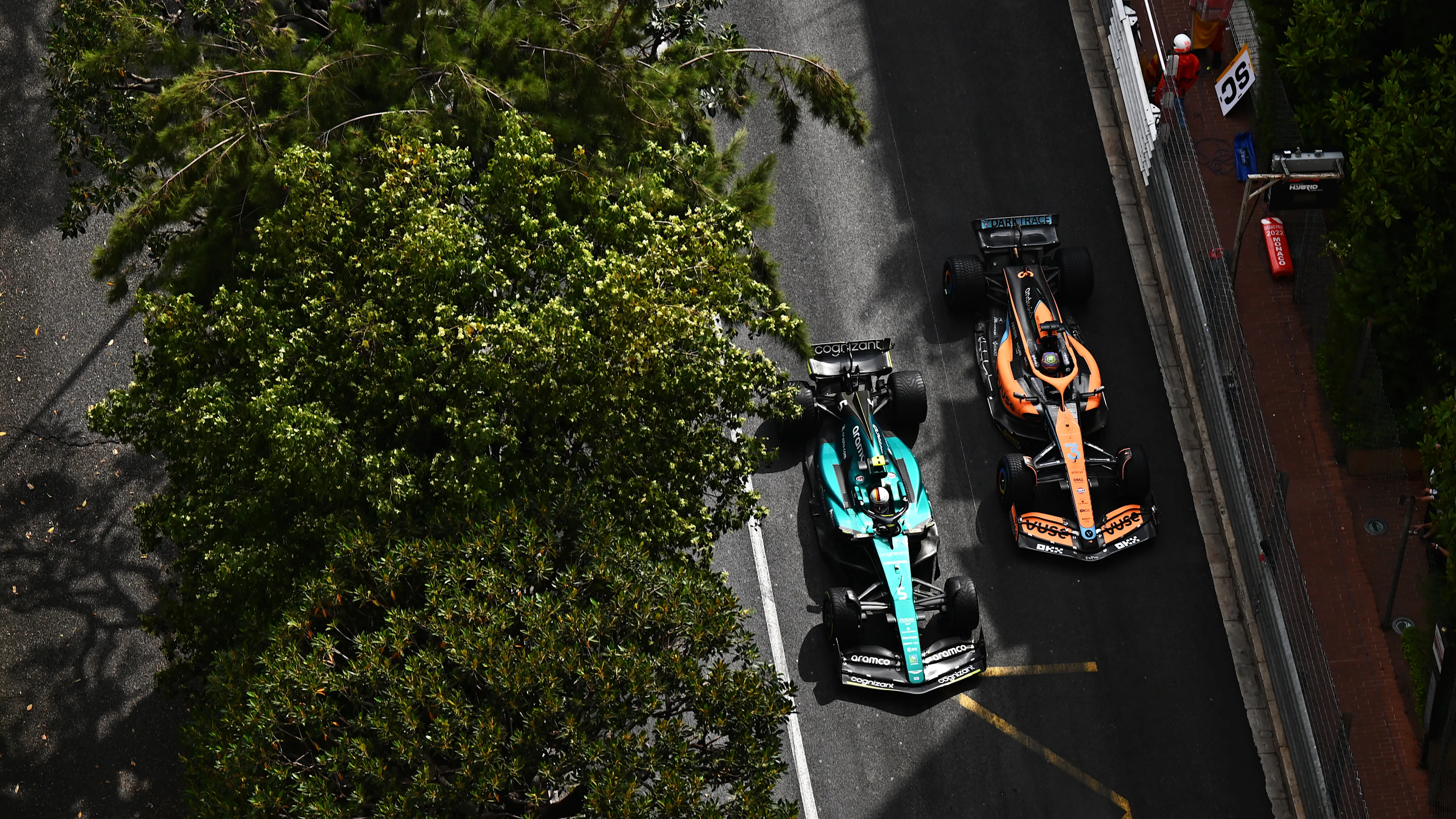 MONTE-CARLO, MONACO - MAY 29: Sebastian Vettel of Germany driving the (5) Aston Martin AMR22 Mercedes and Daniel Ricciardo of Australia driving the (3) McLaren MCL36 Mercedes battle for track position during the F1 Grand Prix of Monaco at Circuit de Monaco on May 29, 2022 in Monte-Carlo, Monaco. (Photo by Clive Mason - Formula 1/Formula 1 via Getty Images)