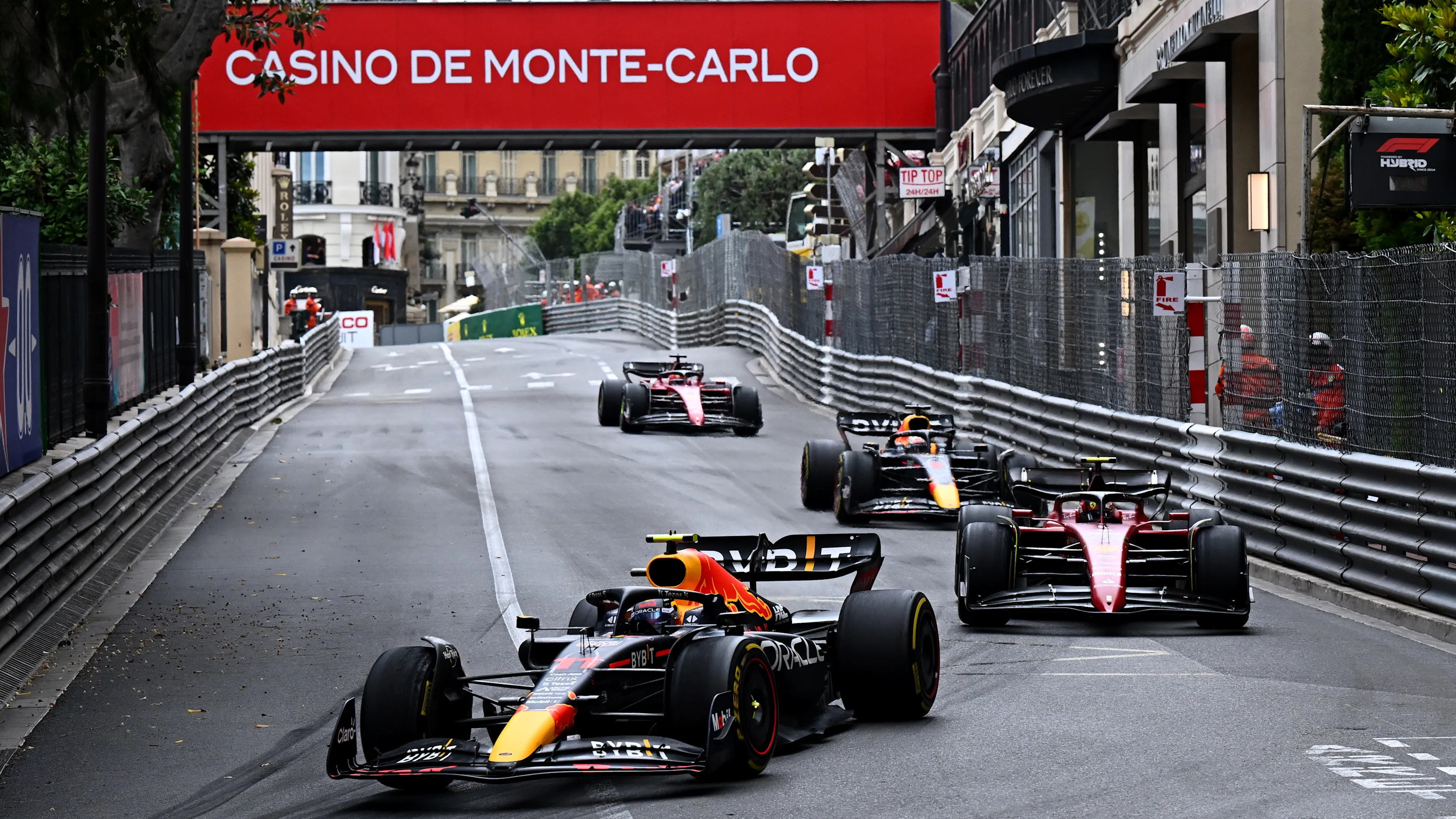 MONTE-CARLO, MONACO - MAY 29: Sergio Perez of Mexico driving the (11) Oracle Red Bull Racing RB18 leads Carlos Sainz of Spain driving (55) the Ferrari F1-75, Max Verstappen of the Netherlands driving the (1) Oracle Red Bull Racing RB18 and Charles Leclerc of Monaco driving the (16) Ferrari F1-75 during the F1 Grand Prix of Monaco at Circuit de Monaco on May 29, 2022 in Monte-Carlo, Monaco. (Photo by Clive Mason - Formula 1/Formula 1 via Getty Images)