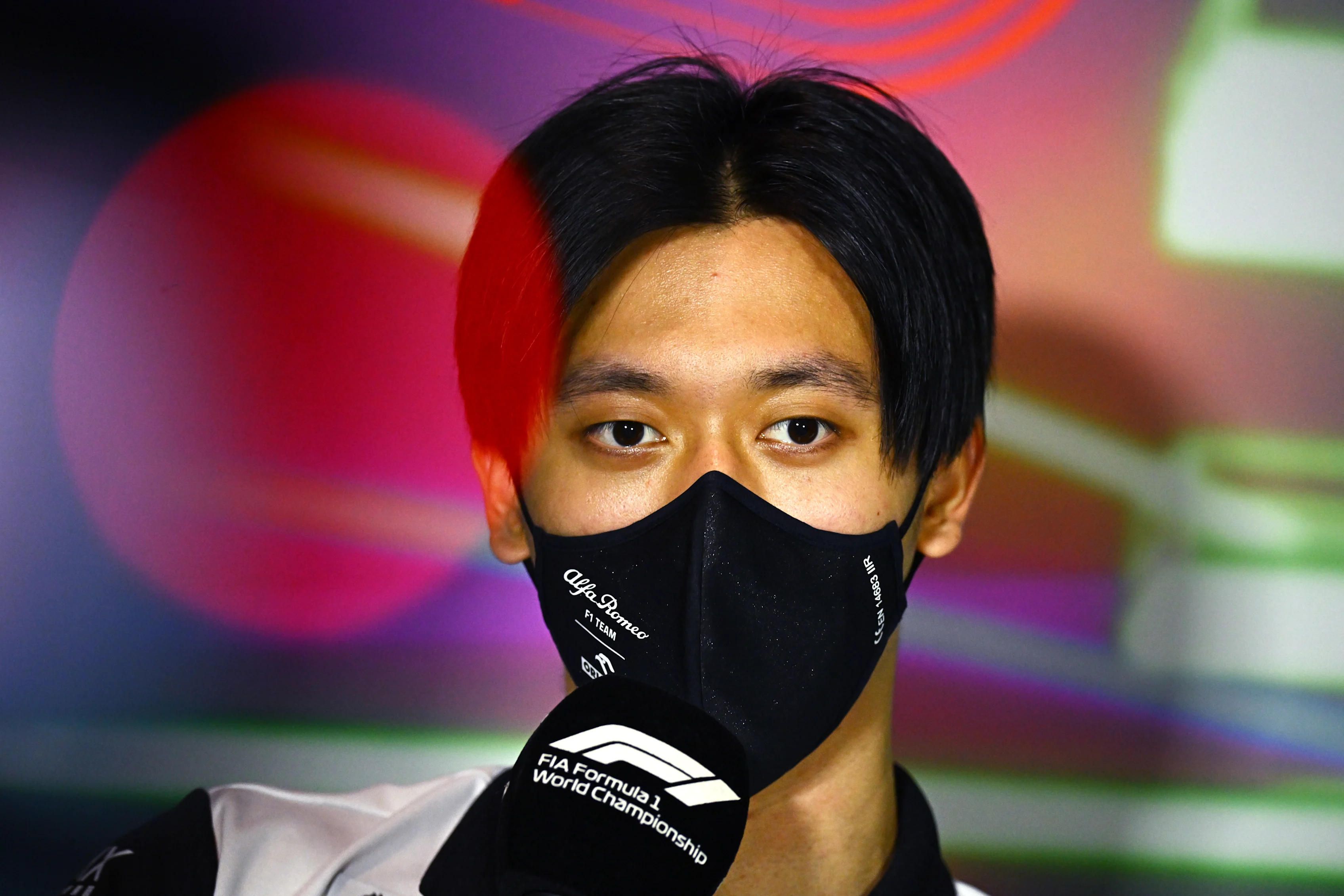 JEDDAH, SAUDI ARABIA - MARCH 25: Zhou Guanyu of China and Alfa Romeo F1 talks in the Drivers Press Conference before practice ahead of the F1 Grand Prix of Saudi Arabia at the Jeddah Corniche Circuit on March 25, 2022 in Jeddah, Saudi Arabia. (Photo by Clive Mason/Getty Images)