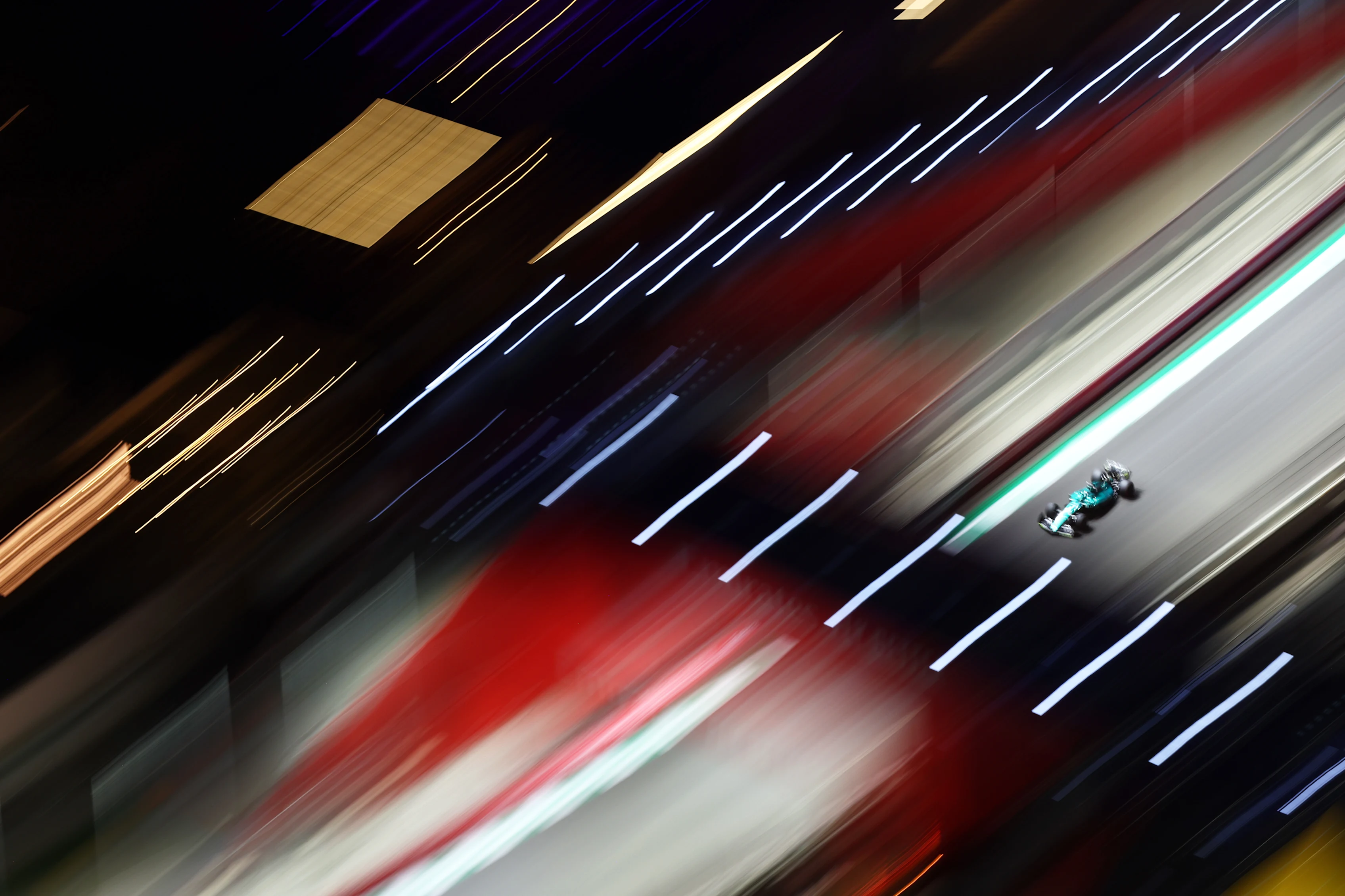 JEDDAH, SAUDI ARABIA - MARCH 26: Lance Stroll of Canada driving the (18) Aston Martin AMR22 Mercedes on track during qualifying ahead of the F1 Grand Prix of Saudi Arabia at the Jeddah Corniche Circuit on March 26, 2022 in Jeddah, Saudi Arabia. (Photo by Clive Rose - Formula 1/Formula 1 via Getty Images)