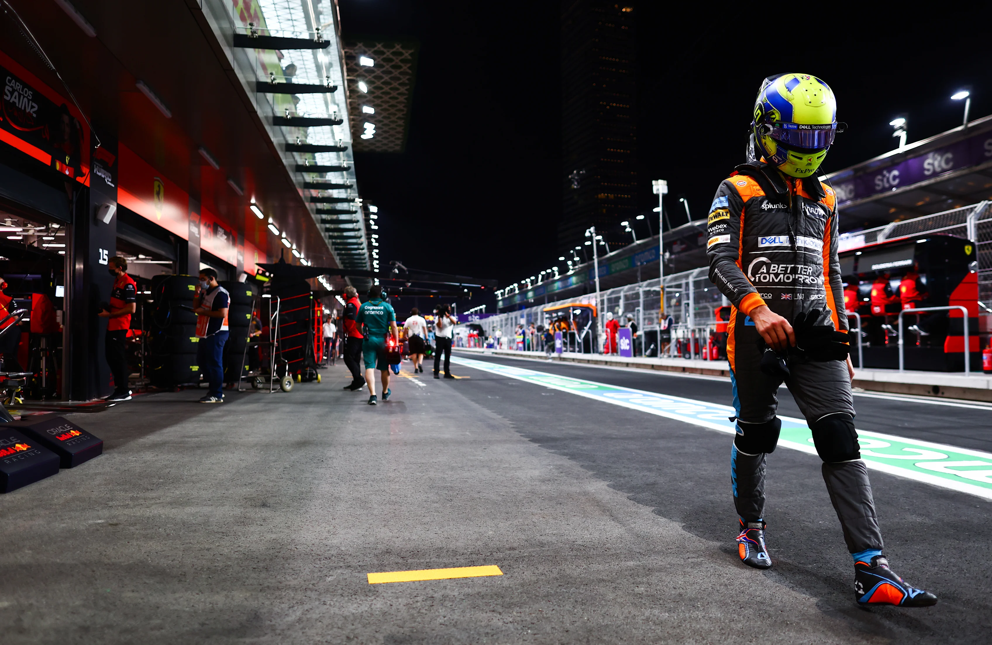 JEDDAH, SAUDI ARABIA - MARCH 26: Lando Norris of Great Britain and McLaren walks in the Pitlane after qualifying in 11th position during qualifying ahead of the F1 Grand Prix of Saudi Arabia at the Jeddah Corniche Circuit on March 26, 2022 in Jeddah, Saudi Arabia. (Photo by Mark Thompson/Getty Images)