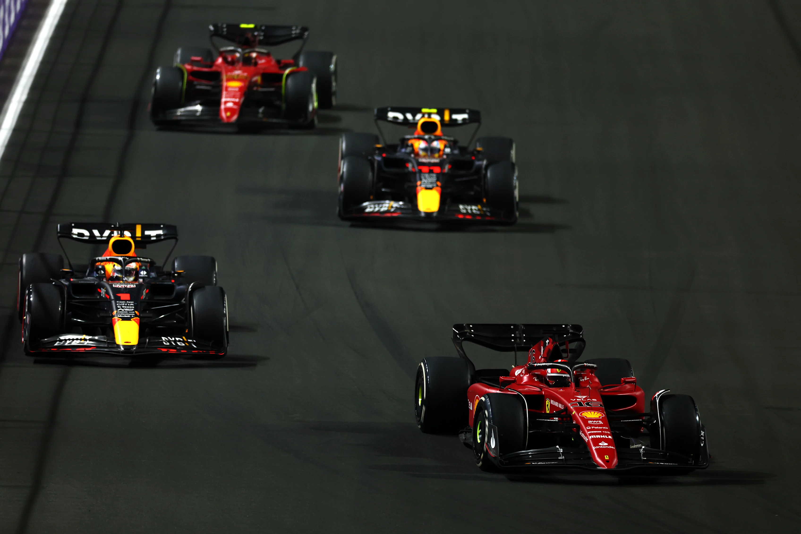 JEDDAH, SAUDI ARABIA - MARCH 27: Charles Leclerc of Monaco driving (16) the Ferrari F1-75 leads Max
