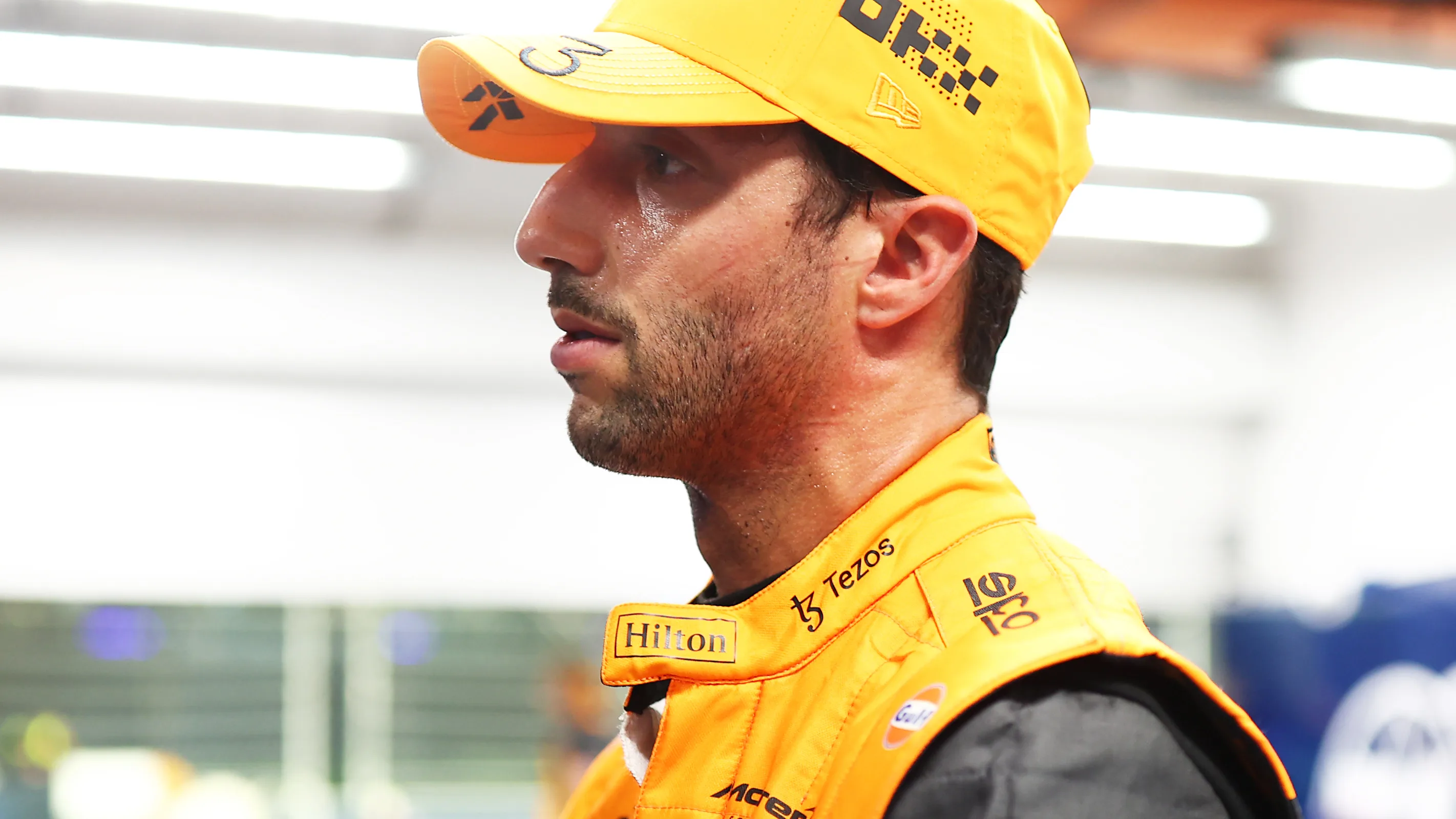 SINGAPORE, SINGAPORE - OCTOBER 01: Seventeenth placed qualifier Daniel Ricciardo of Australia and McLaren is weighed in the FIA garage during qualifying ahead of the F1 Grand Prix of Singapore at Marina Bay Street Circuit on October 01, 2022 in Singapore, Singapore. (Photo by Dan Istitene - Formula 1/Formula 1 via Getty Images)