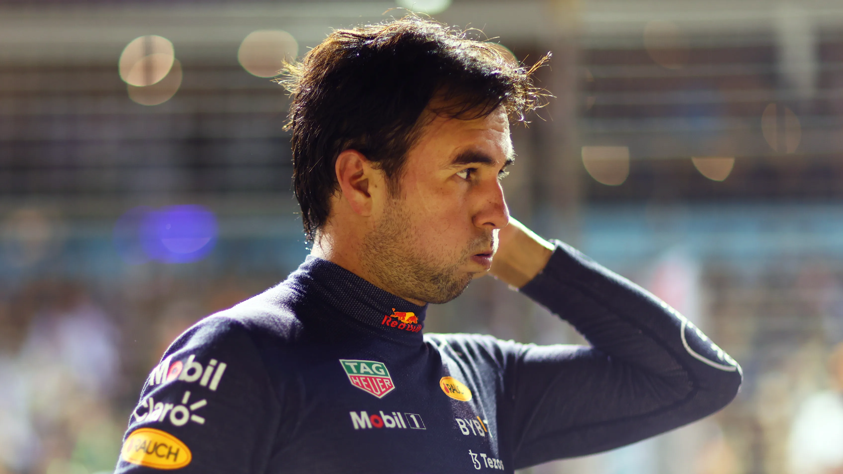 SINGAPORE, SINGAPORE - OCTOBER 01: Second placed qualifier Sergio Perez of Mexico and Oracle Red Bull Racing looks on in parc ferme during qualifying ahead of the F1 Grand Prix of Singapore at Marina Bay Street Circuit on October 01, 2022 in Singapore, Singapore. (Photo by Dan Istitene - Formula 1/Formula 1 via Getty Images)