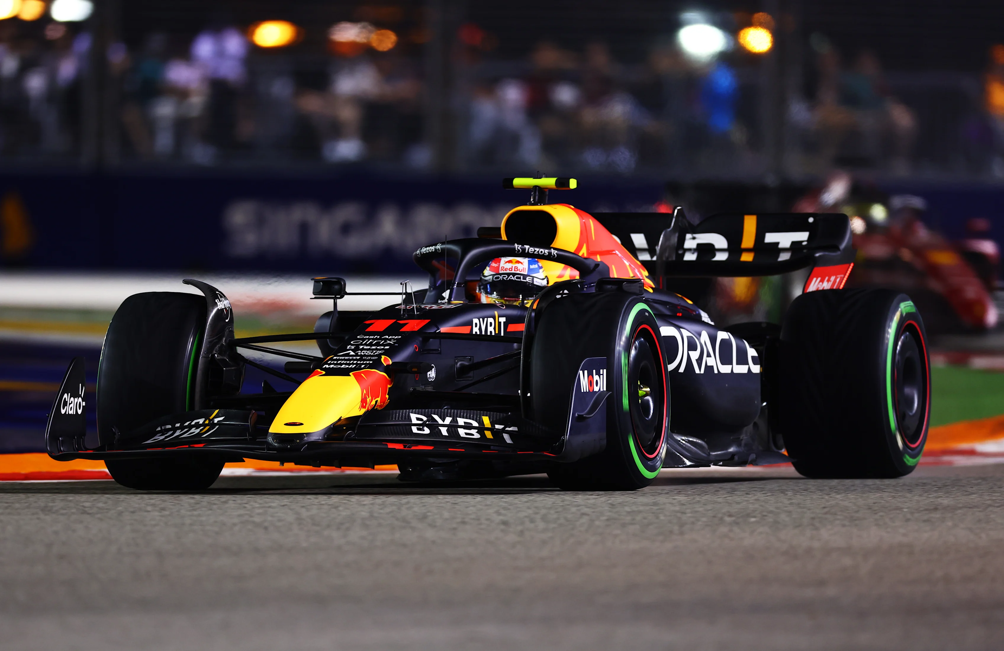 SINGAPORE, SINGAPORE - OCTOBER 02: Sergio Perez of Mexico driving the (11) Oracle Red Bull Racing