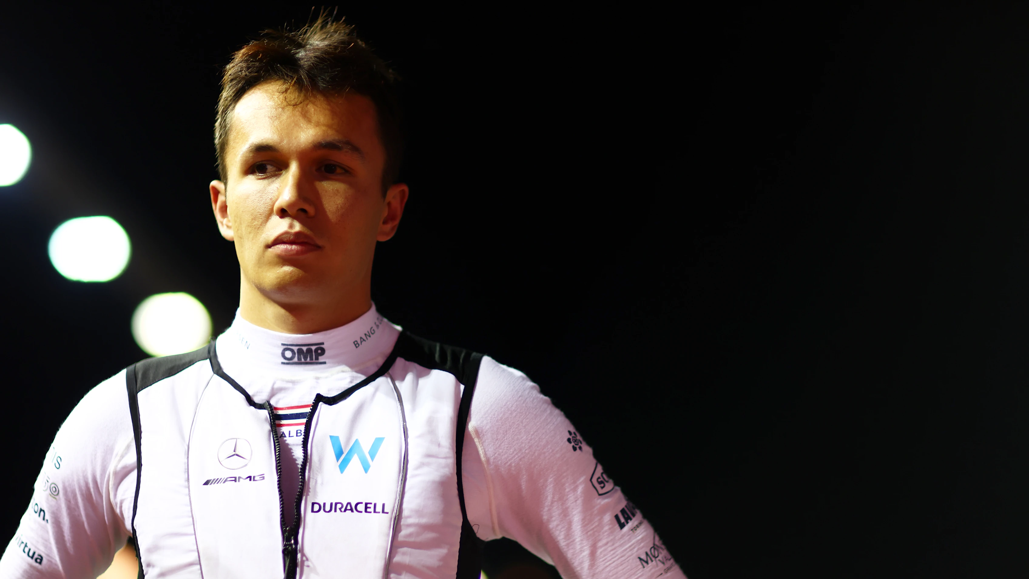 SINGAPORE, SINGAPORE - OCTOBER 02: Alexander Albon of Thailand and Williams looks on from the grid