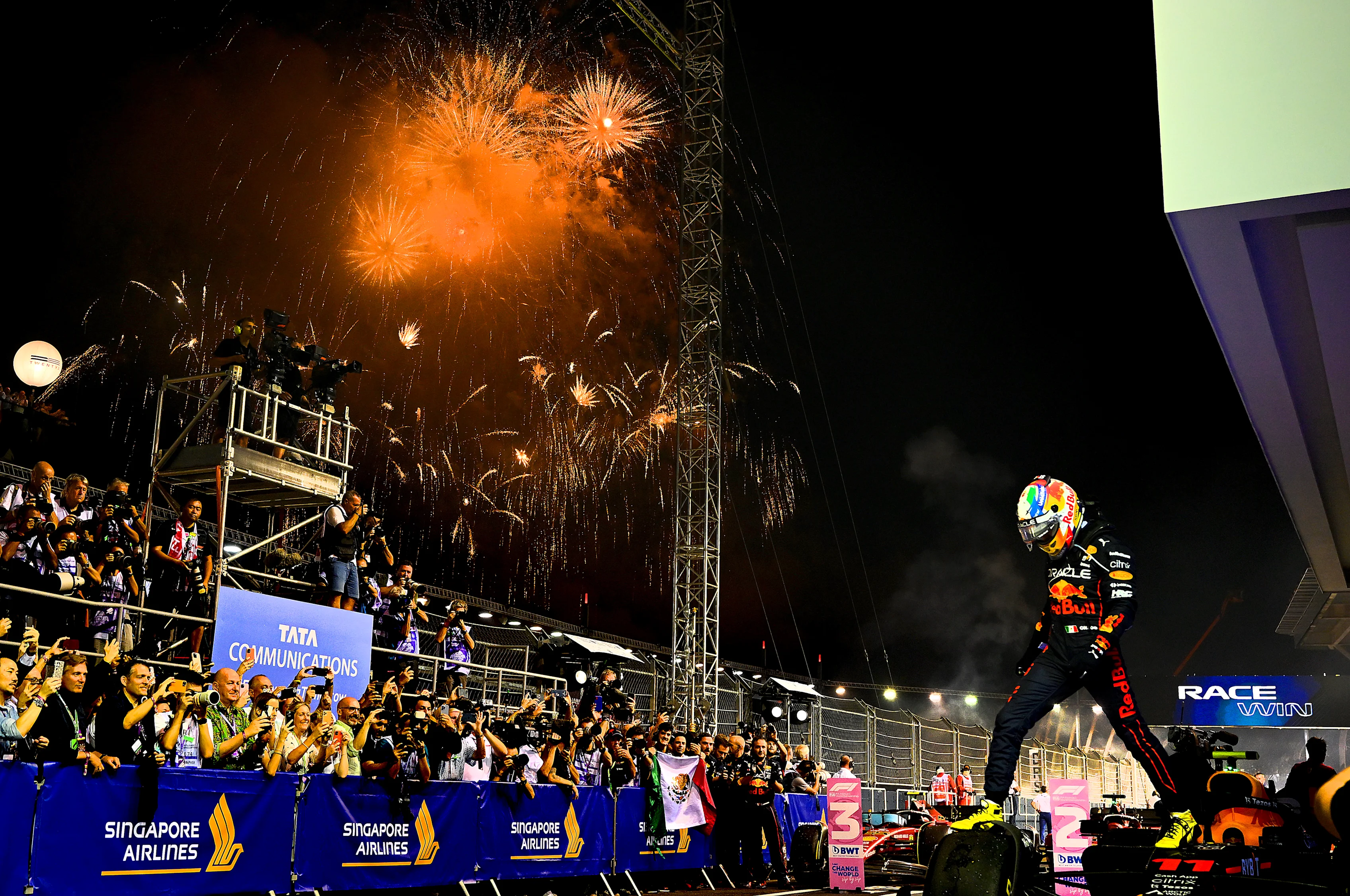 SINGAPORE, SINGAPORE - OCTOBER 02: Race winner Sergio Perez of Mexico and Oracle Red Bull Racing