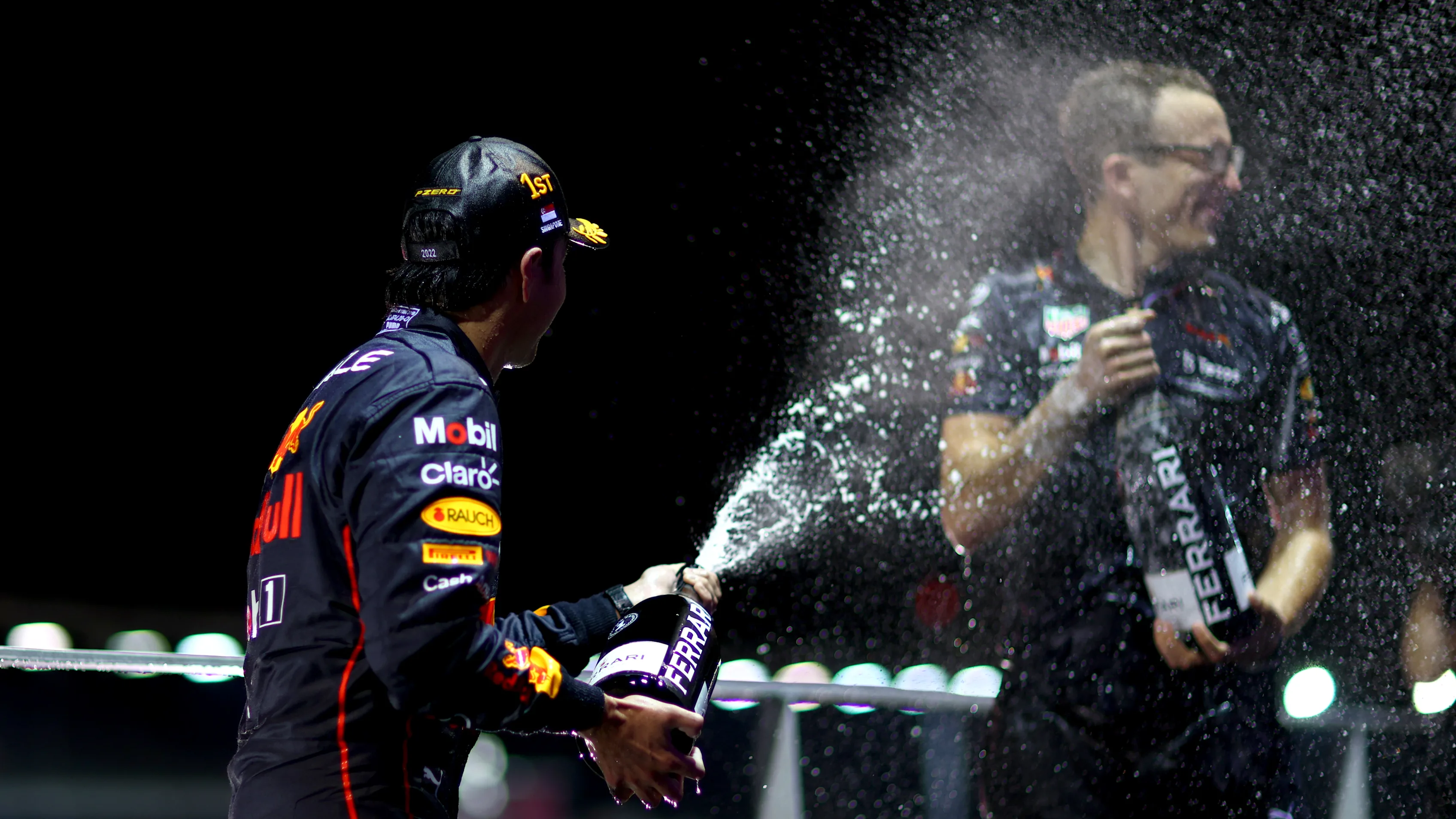 SINGAPORE, SINGAPORE - OCTOBER 02: Race winner Sergio Perez of Mexico and Oracle Red Bull Racing