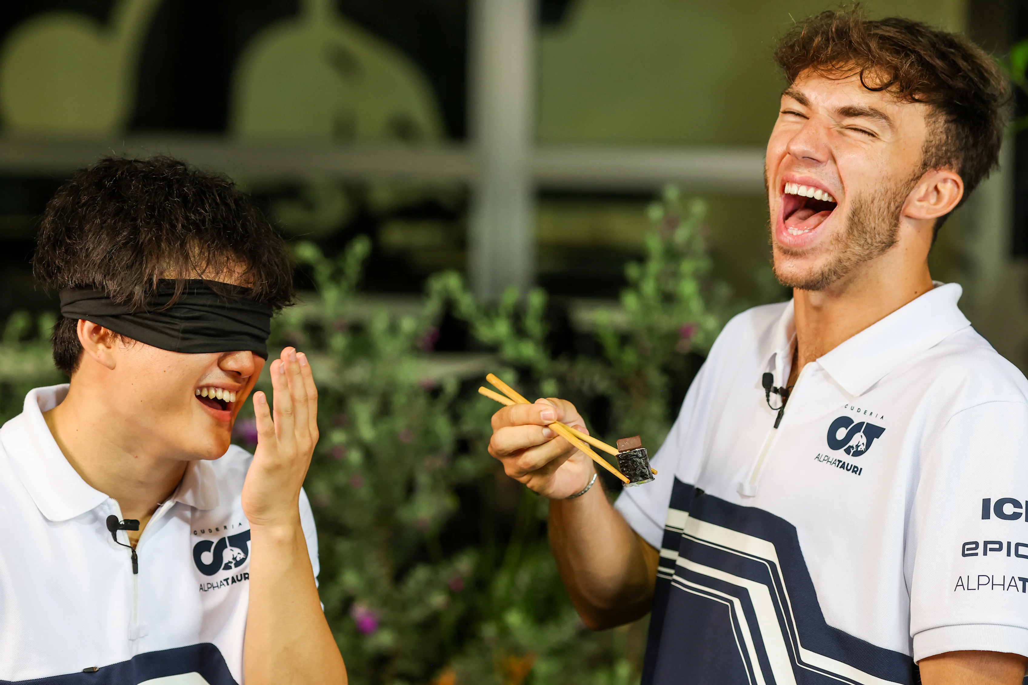 SINGAPORE, SINGAPORE - SEPTEMBER 29: Yuki Tsunoda of Scuderia AlphaTauri and Japan and Pierre Gasly