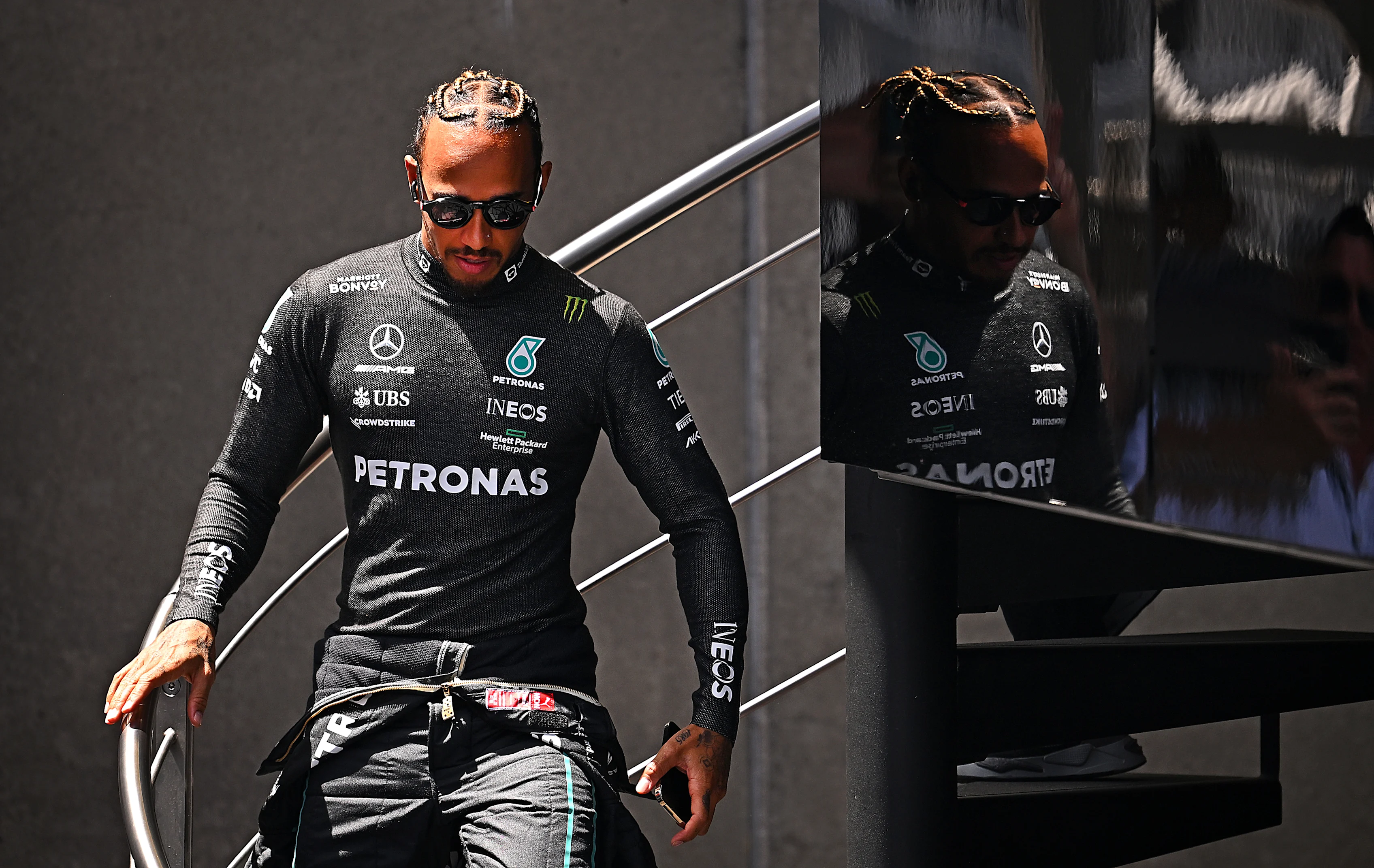 BARCELONA, SPAIN - MAY 21: Lewis Hamilton of Great Britain and Mercedes walks in the Paddock during