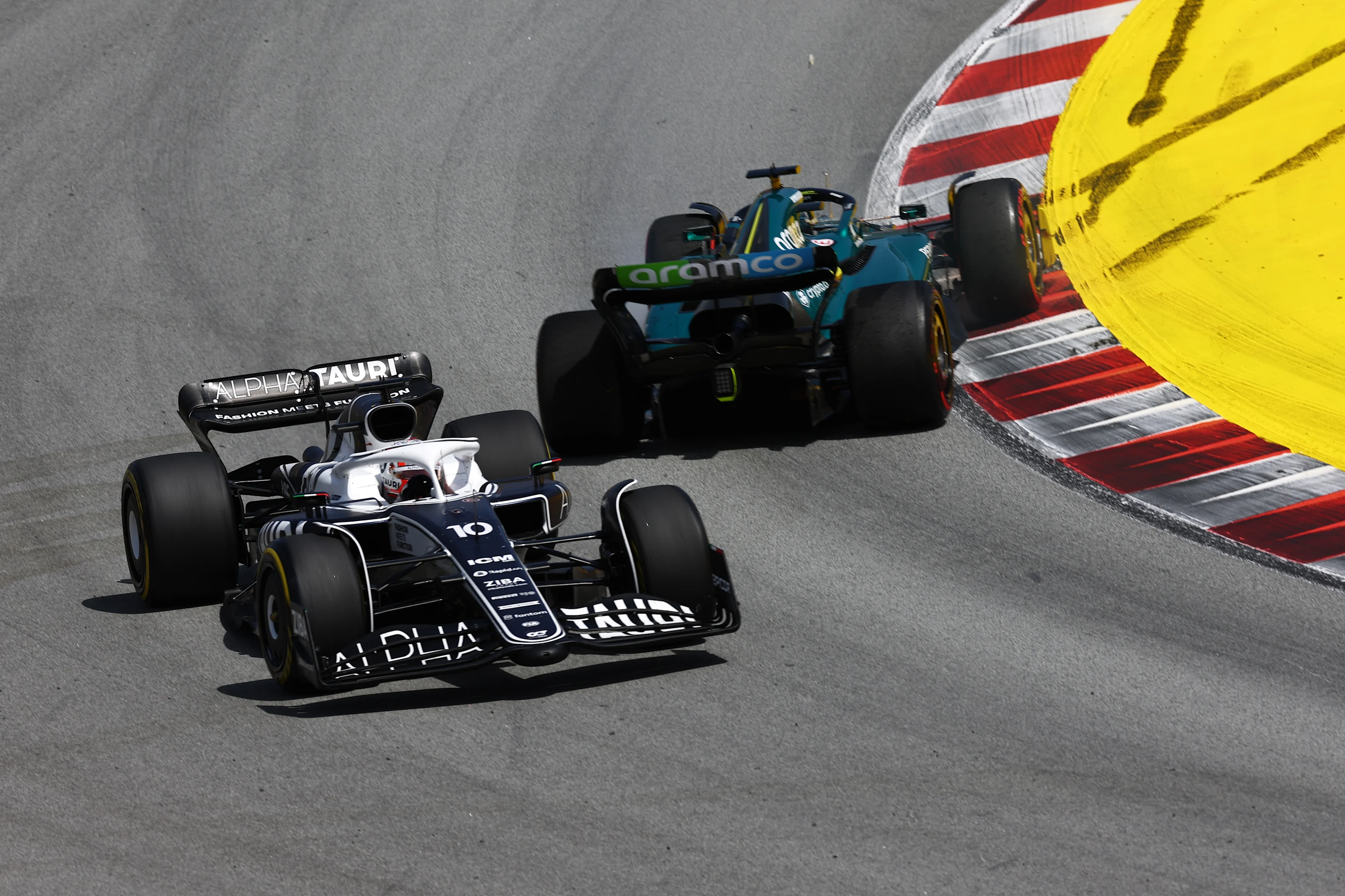 BARCELONA, SPAIN - MAY 22: Pierre Gasly of France driving the (10) Scuderia AlphaTauri AT03 past a