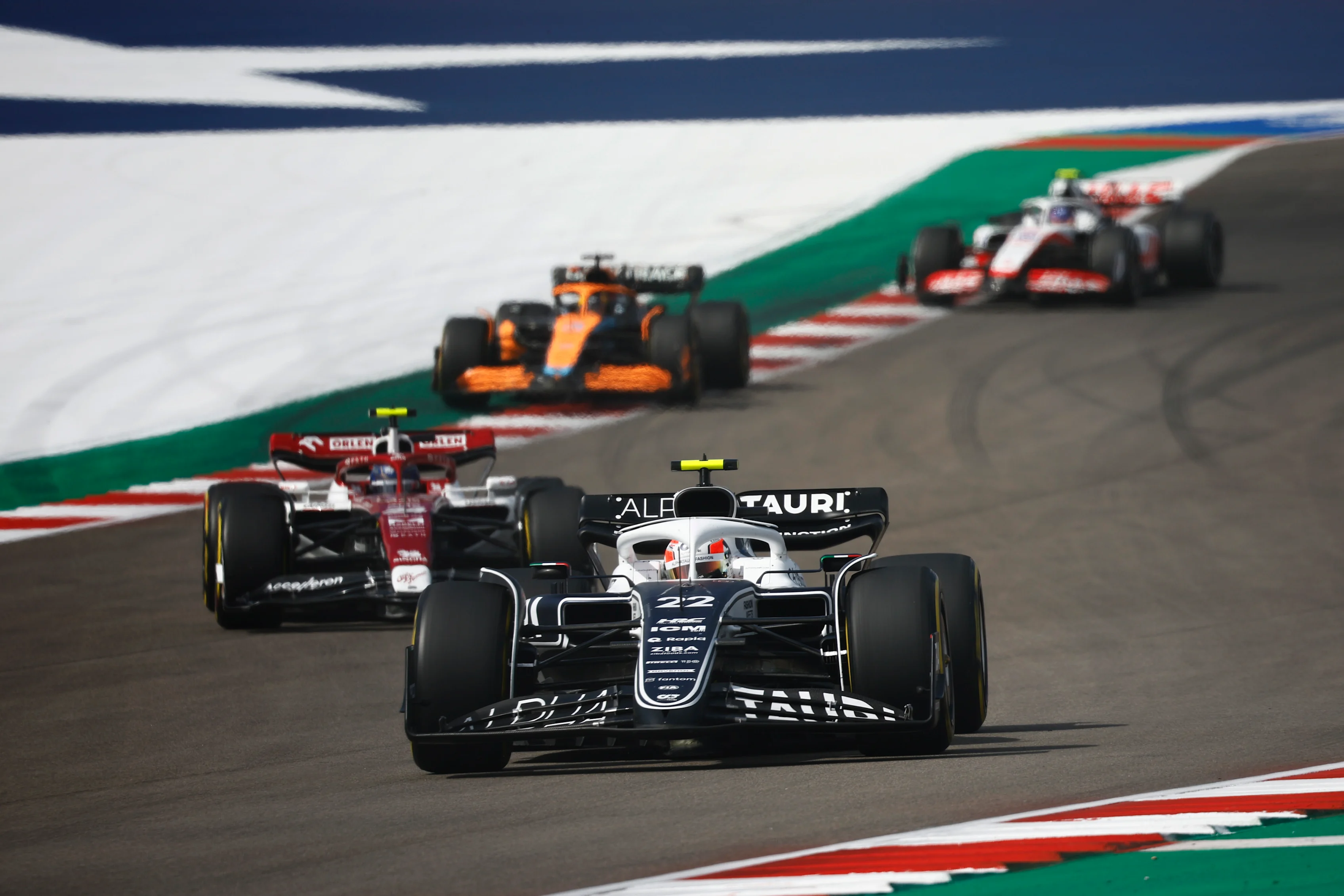 AUSTIN, TEXAS - OCTOBER 23: Yuki Tsunoda of Japan driving the (22) Scuderia AlphaTauri AT03 leads