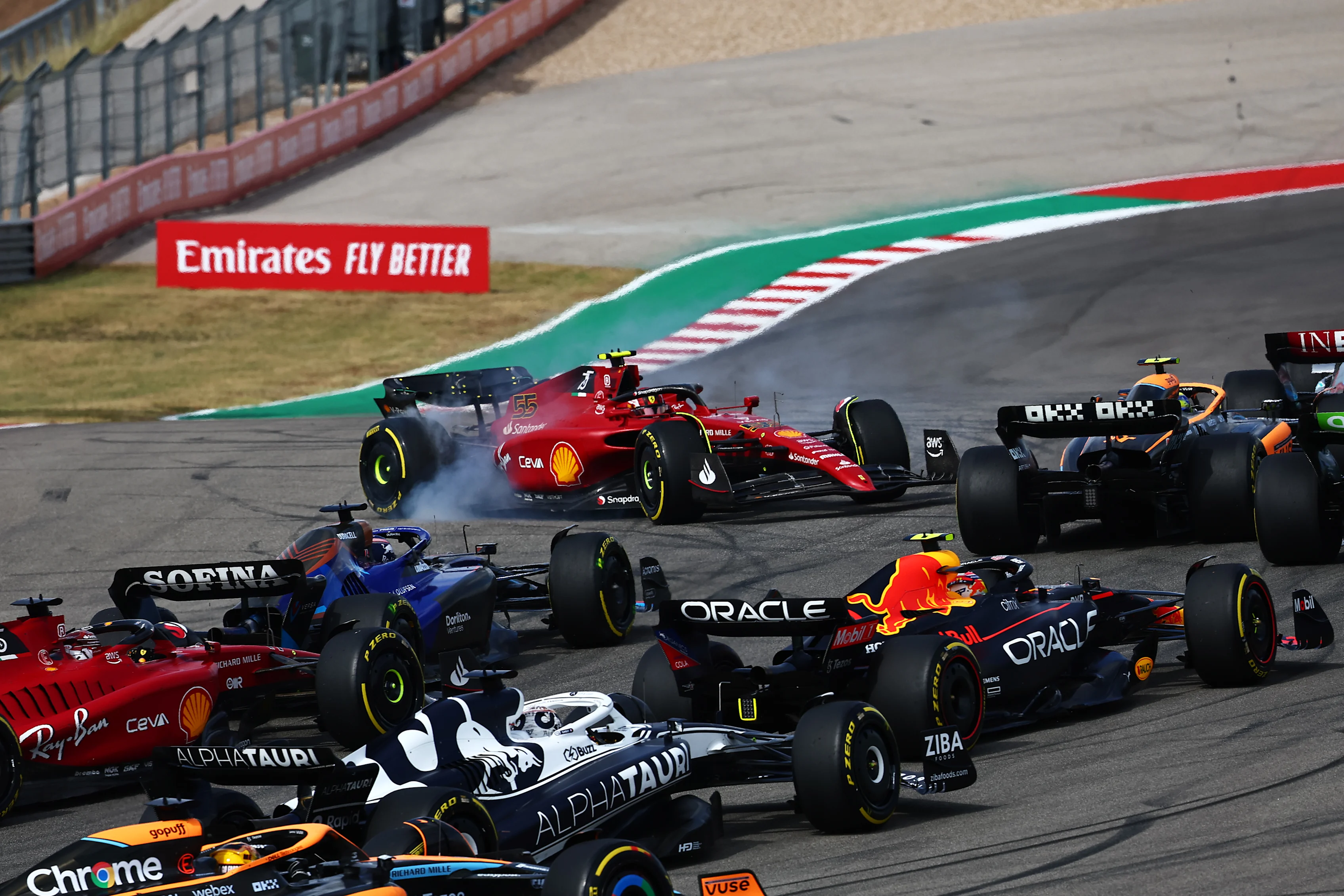 AUSTIN, TEXAS - OCTOBER 23: Carlos Sainz of Spain driving (55) the Ferrari F1-75 spins at the start