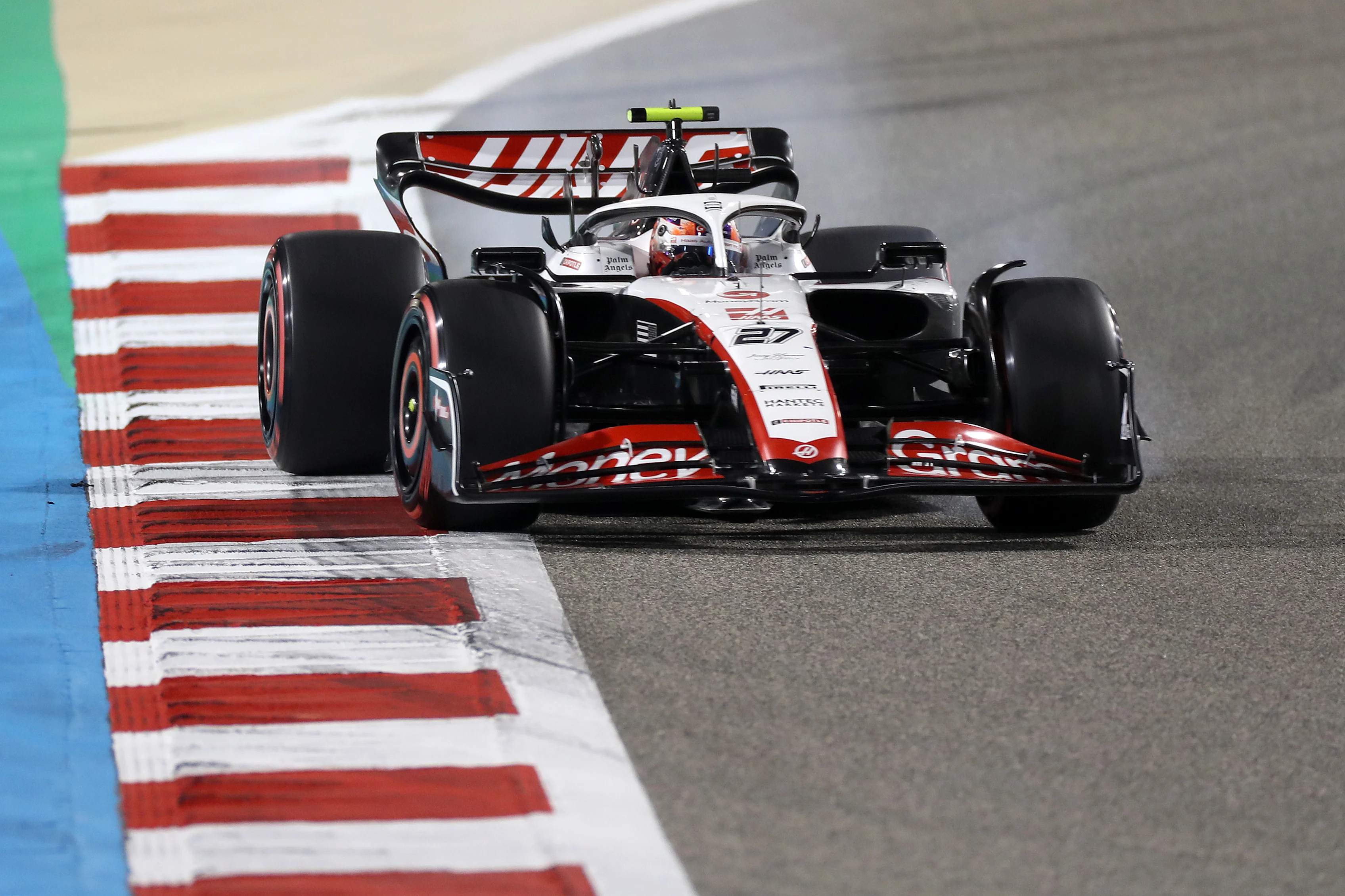 BAHRAIN, BAHRAIN - MARCH 04: Nico Hulkenberg of Germany driving the (27) Haas F1 VF-23 Ferrari locks a wheel under braking during qualifying ahead of the F1 Grand Prix of Bahrain at Bahrain International Circuit on March 04, 2023 in Bahrain, Bahrain. (Photo by Peter Fox/Getty Images)