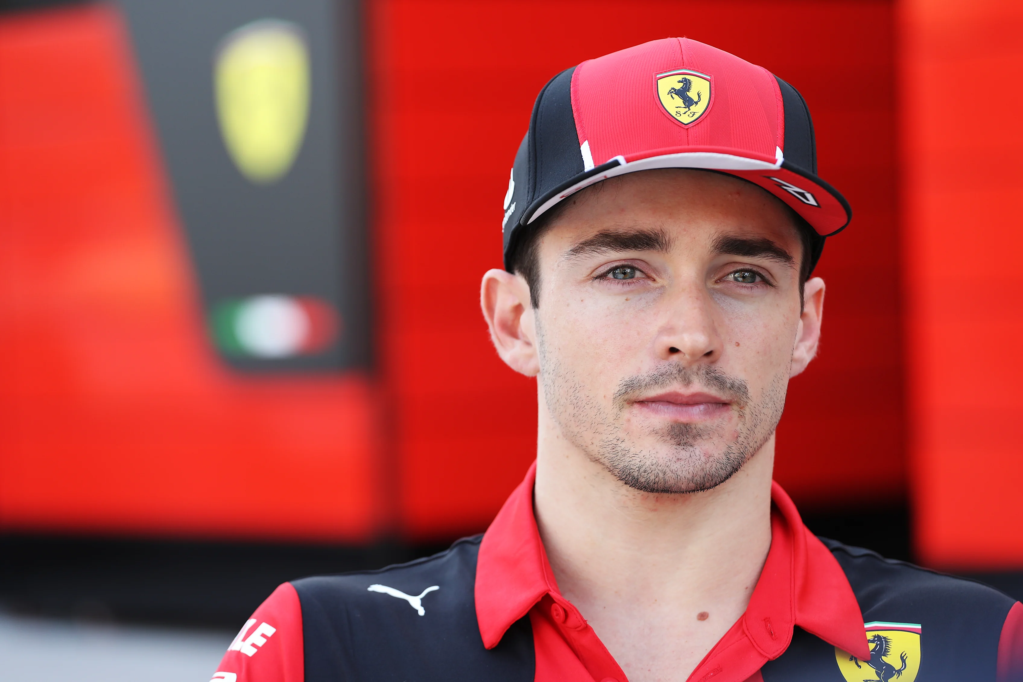 BAHRAIN, BAHRAIN - FEBRUARY 25: Charles Leclerc of Monaco and Ferrari looks on in the Paddock