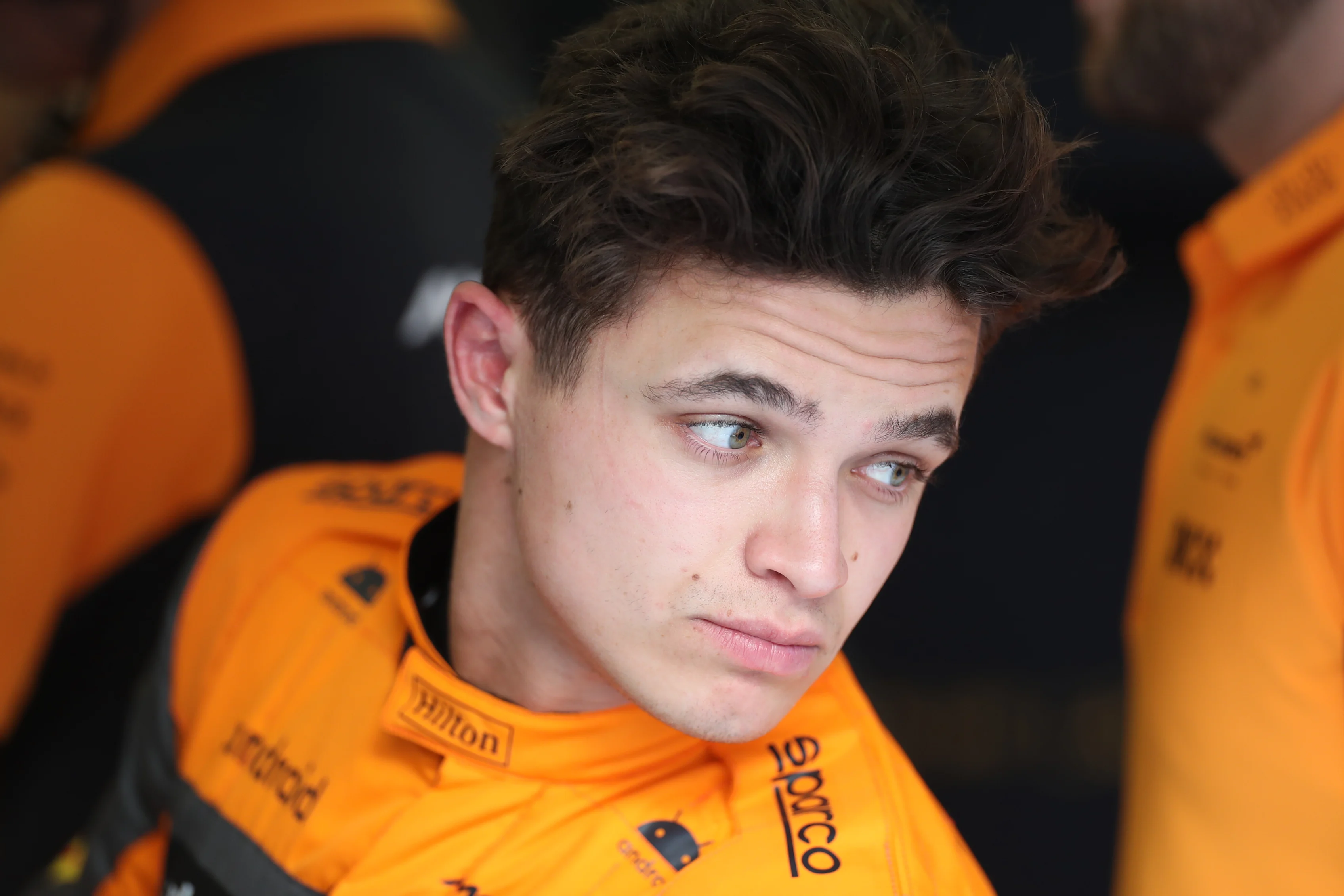 BAHRAIN, BAHRAIN - FEBRUARY 23: Lando Norris of Great Britain and McLaren looks on in the garage