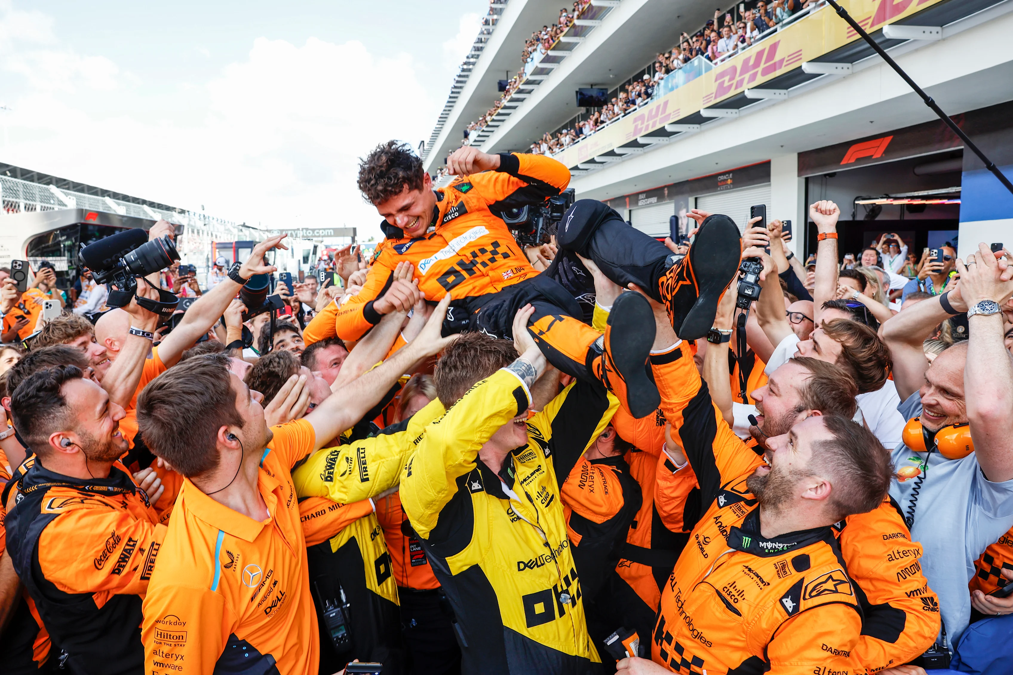 Lando Norris, McLaren F1 Team, 1st position, celebrates with his team on arrival in Parc Ferme