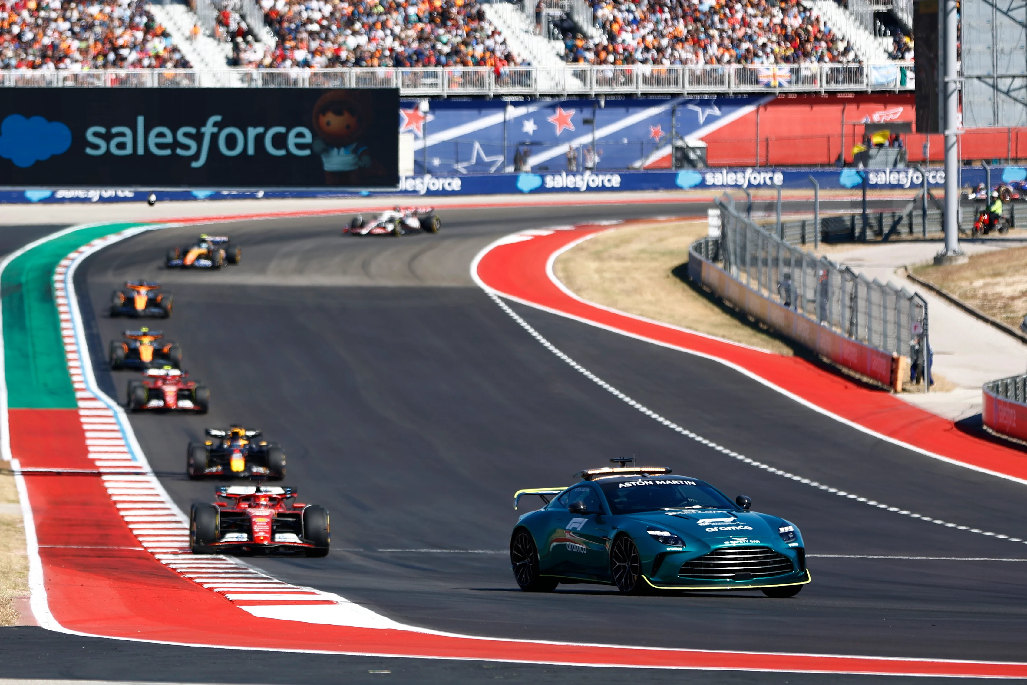 The safety car leads Charles Leclerc, Ferrari SF-24, Max Verstappen, Red Bull Racing RB20, Carlos