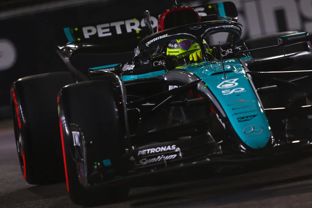 SINGAPORE, SINGAPORE - SEPTEMBER 21: Lewis Hamilton of Great Britain driving the (44) Mercedes AMG