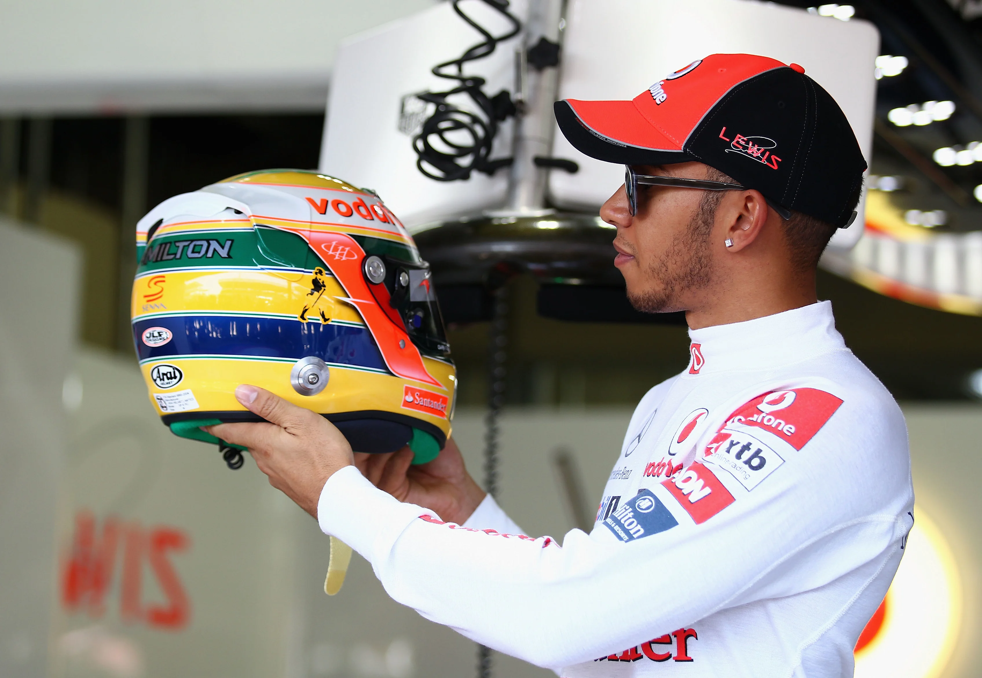 Lewis Hamilton pays tribute to his idol Senna with a special helmet for the Sao Paulo Grand Prix in 2011. Swipe to see more images