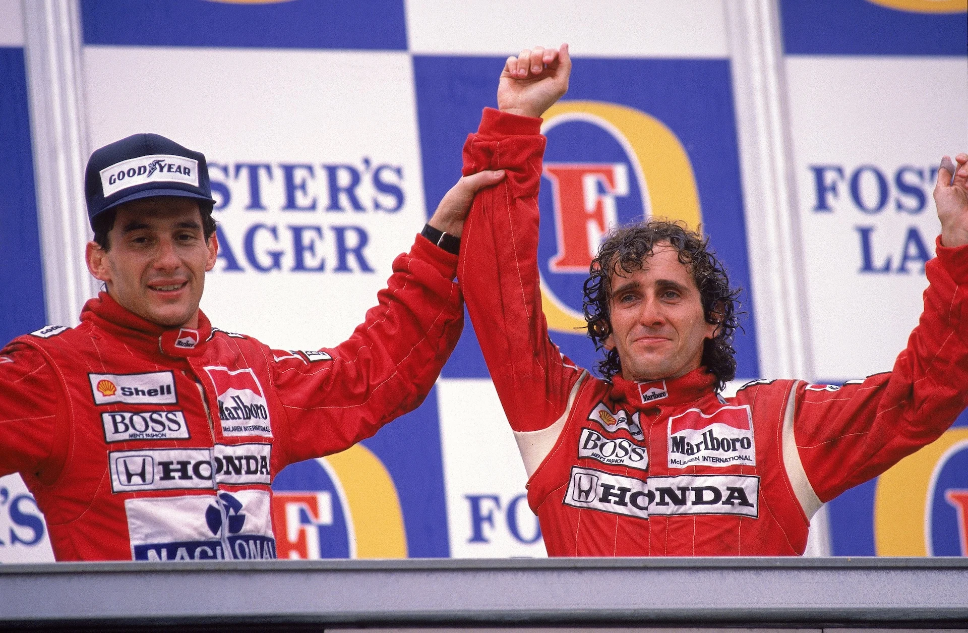 13 Nov 1988: McLaren Honda driver Alain Prost of France celebrates his victory with team-mate