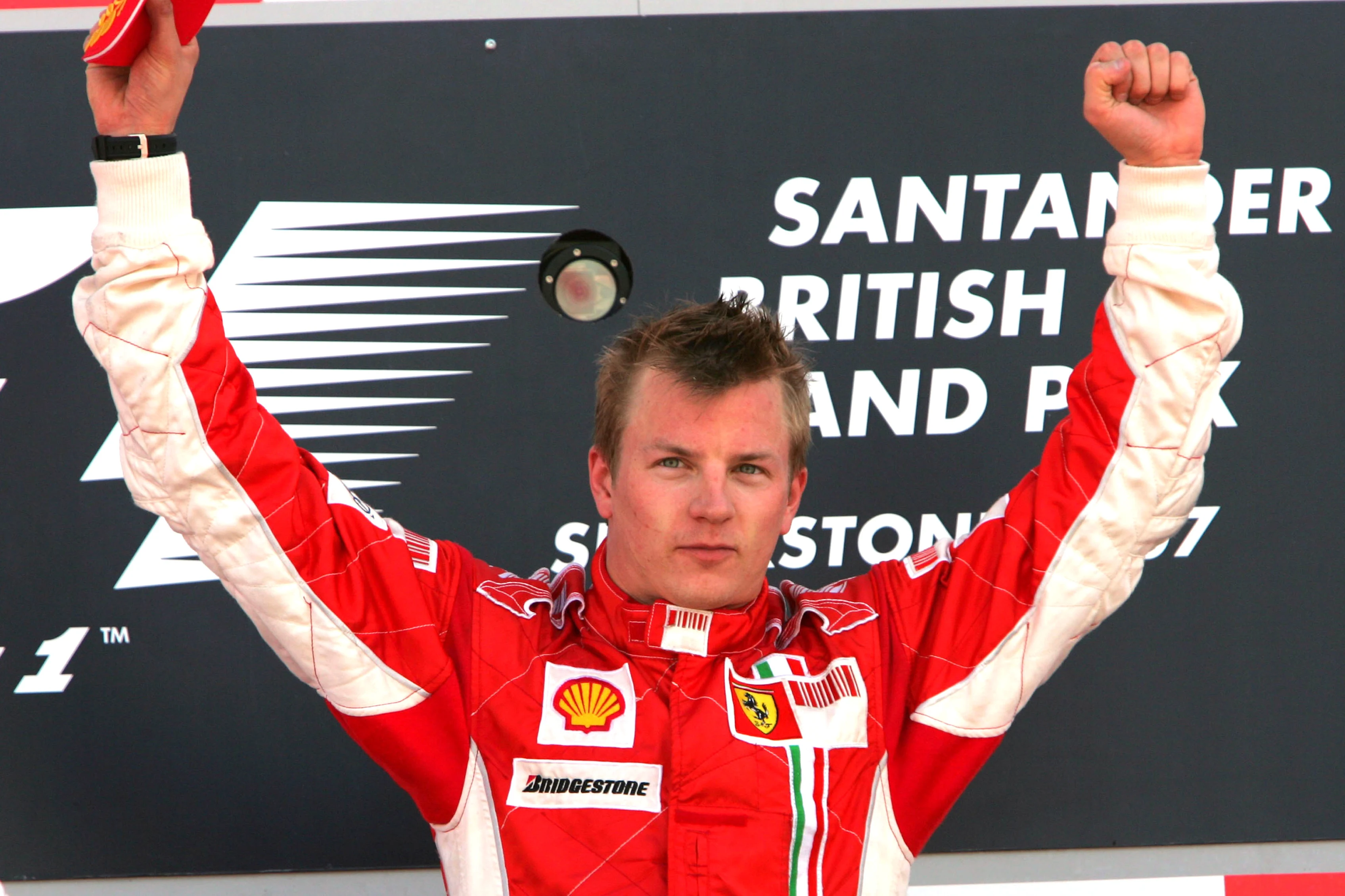 Kimi Raikkonen (FIN) Ferrari on the podium. Formula One World Championship, Rd 9, British Grand