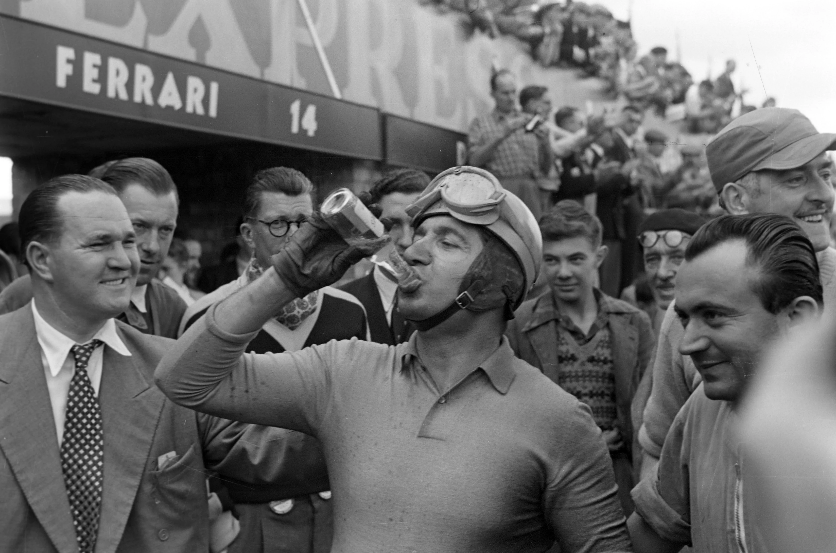 SILVERSTONE CIRCUIT, UNITED KINGDOM - JULY 19: Alberto Ascari celebrates winning the race by a lap