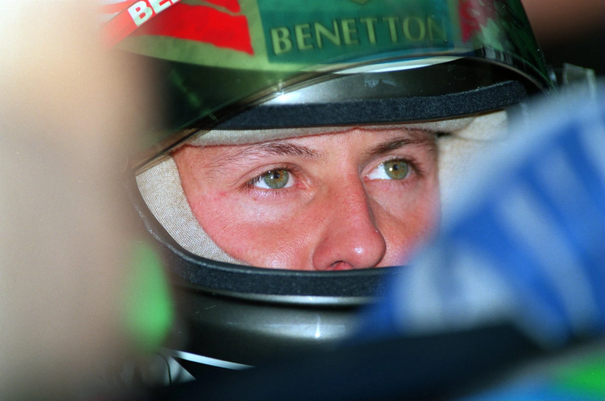 9 JUL 1994: FORMULA ONE WORLD CHAMPIONSHIP LEADER MICHAEL SCHUMACHER OF GERMANY LOOKS UP AT HIS