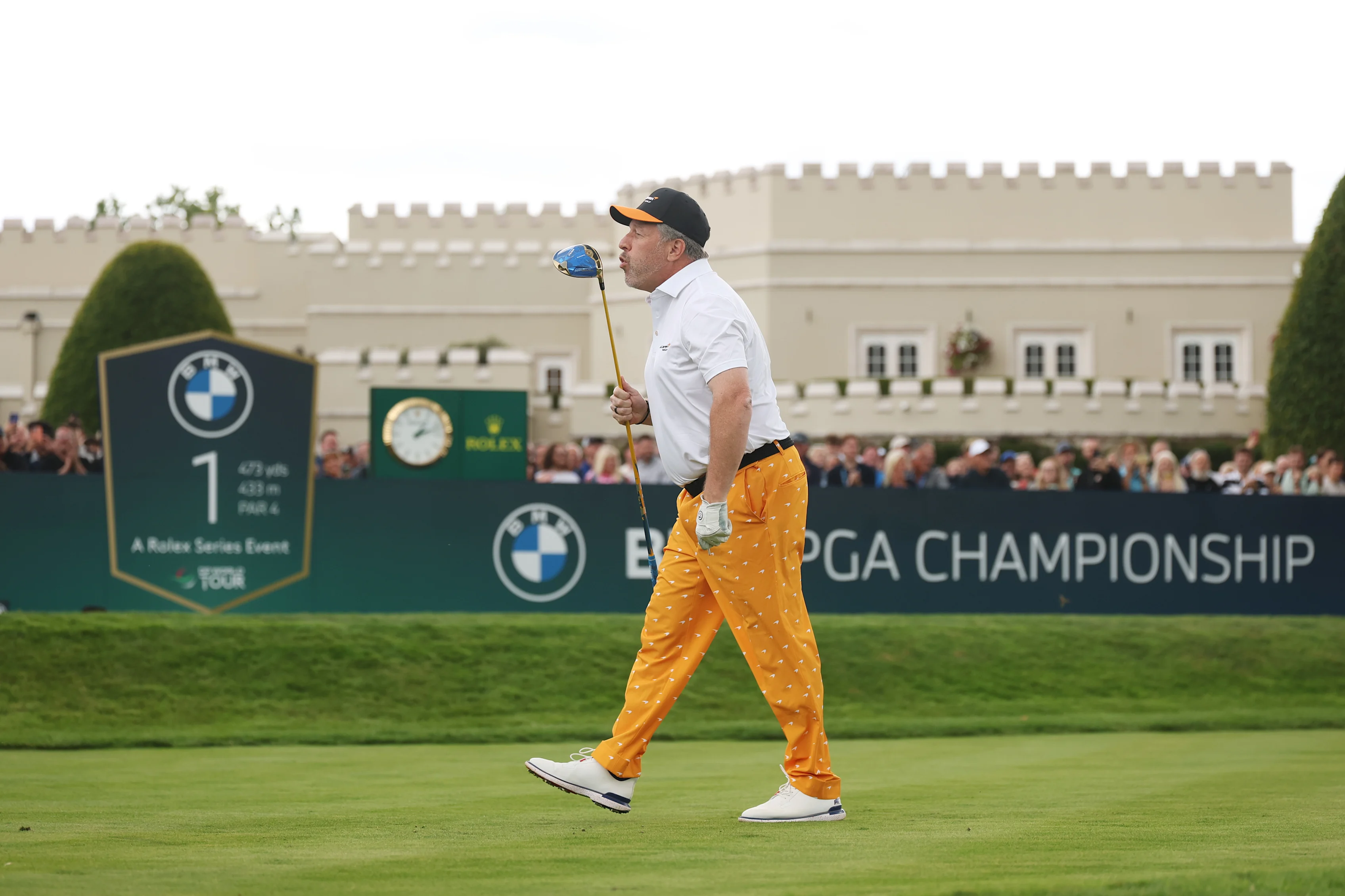 VIRGINIA WATER, ENGLAND - SEPTEMBER 16: Zak Brown reacts following his tee shot on the first hole