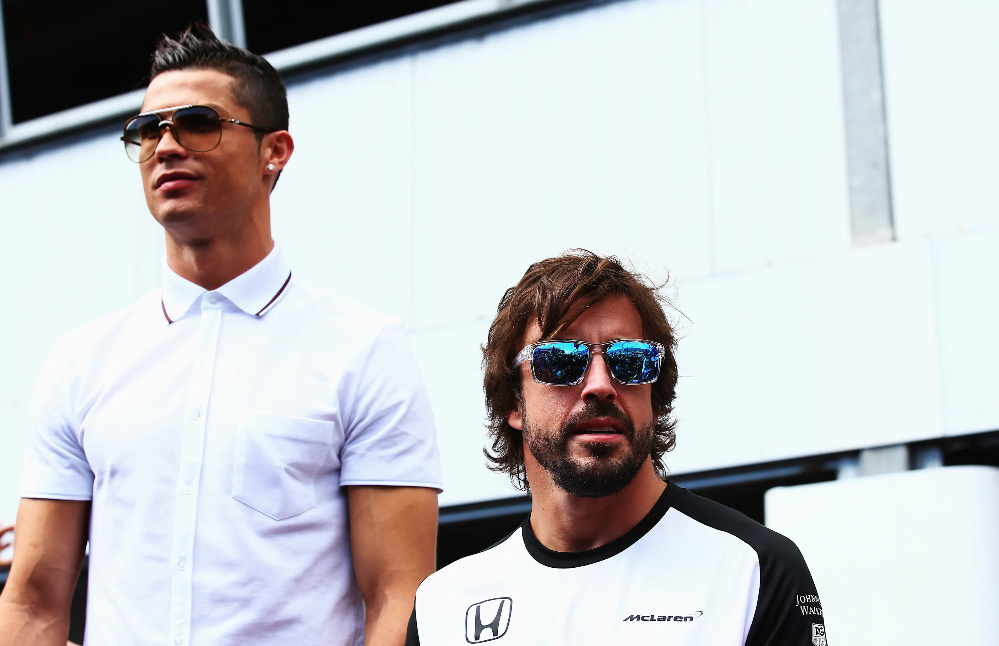 MONTE-CARLO, MONACO - MAY 24: Real Madrid footballer Cristiano Ronaldo meets Fernando Alonso of